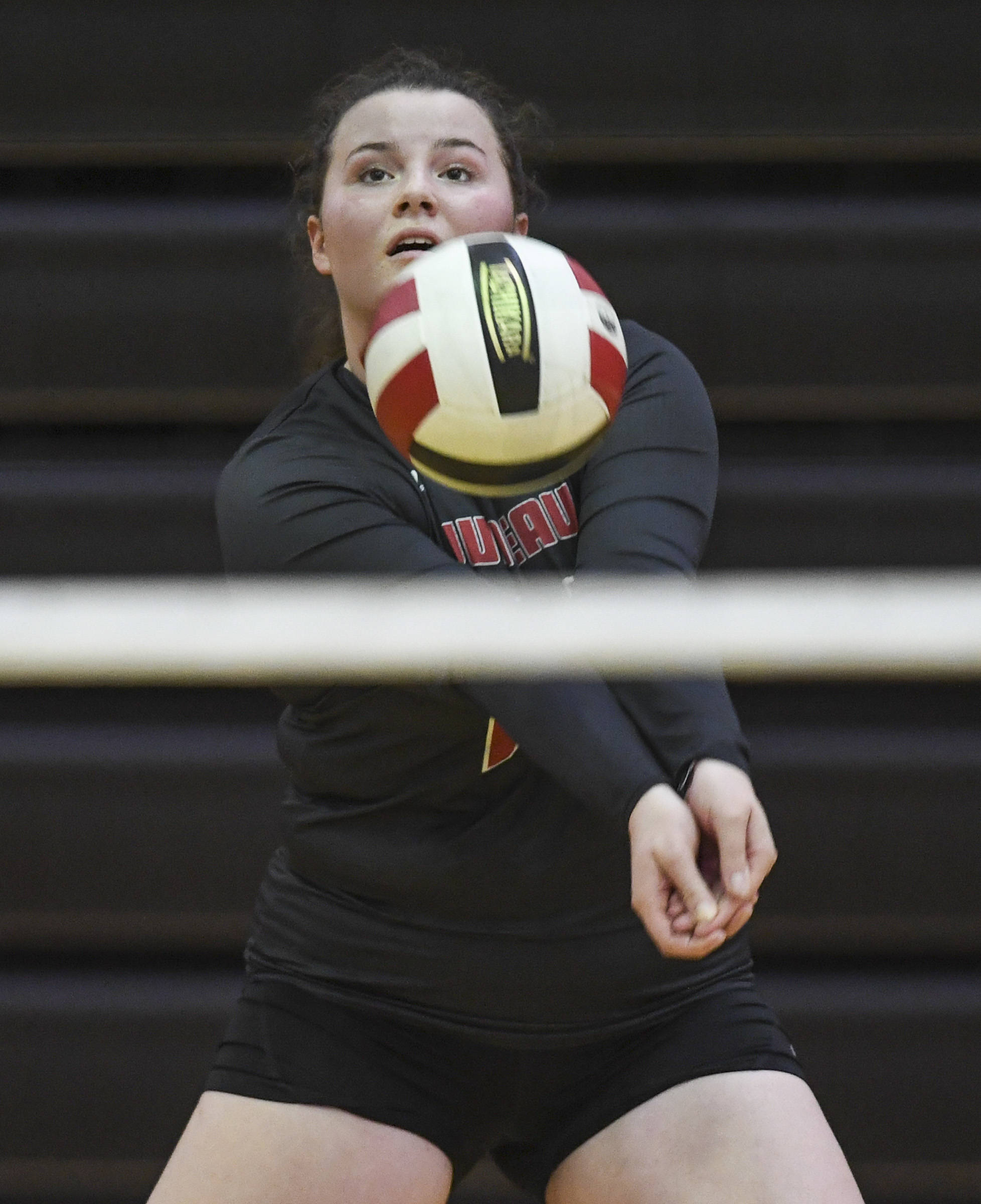 Juneau-Douglas Gabi Griggs bumps the ball up at the Volleyball Jamboree at Juneau-Douglas High School: Yadaa.at Kalé on Friday, Aug. 30, 2019. (Michael Penn | Juneau Empire File)