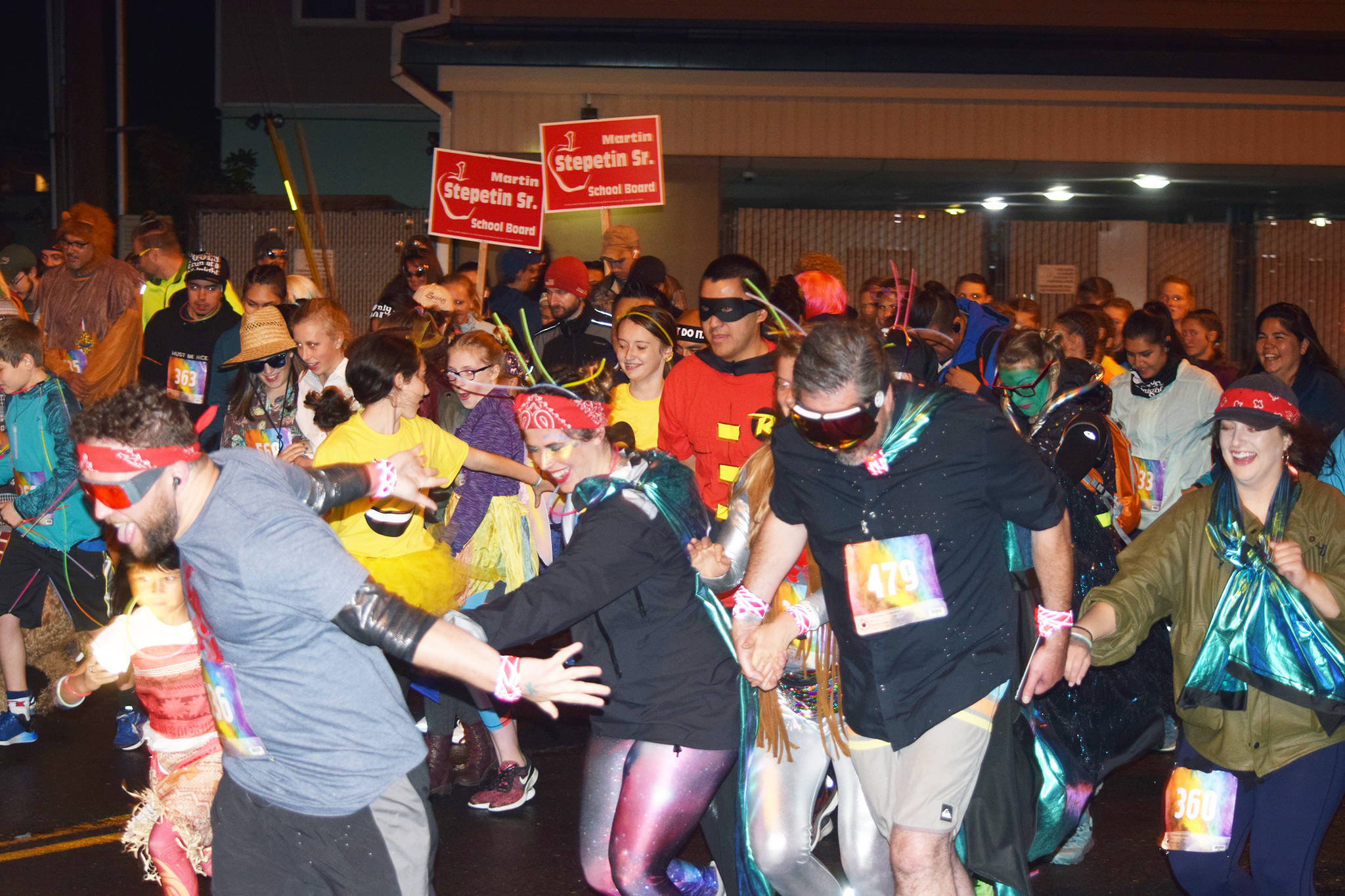 Runners take off from the starting line of the 35th annual Only Fools Run at Midnight at 11:59 p.m. on Saturday, Sept. 21, 2019. The event included a costume contest and 1-mile and 5-kilometer run/walk/wheelchair. (Nolin Ainsworth | Juneau Empire)