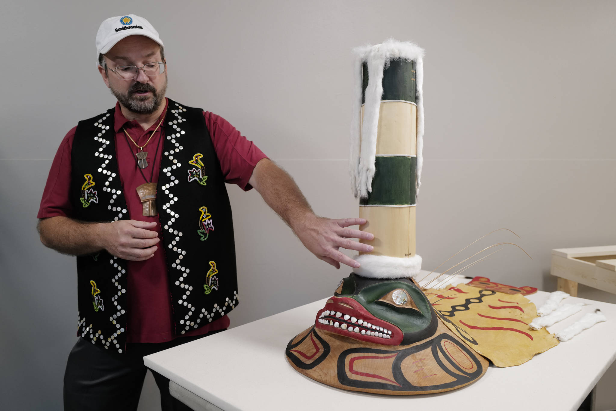 Eric Hollinger, Tribal Liaison for the Repatriation Office of the Smithsonian’s National Museum of Natural History, talks about a sculpin clan hat replica before a welcoming ceremony at Elizabeth Peratrovich Hall on Wednesday, Sept. 25, 2019. The original hat was collected from the Kiks.ádi Clan in Sitka in 1884. The Smithsonian Institution used a 3D digitization process to document the hat and construct the hat using traditional materials. (Michael Penn | Juneau Empire)