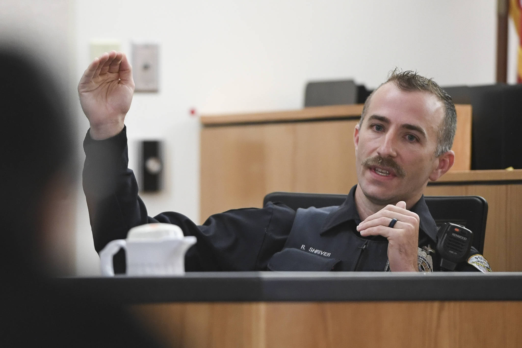 Juneau Police Department Officer Ronald Shriver answers questions on the witness stand from defense attorney Natasha Norris in Juneau Superior Court on Tuesday, Sept. 24, 2019, during Graham’s trial. Graham is facing two counts of first-degree murder for the November 2015 shooting deaths of 36-year-old Robert H. Meireis and 34-year-old Elizabeth K. Tonsmeire. Shriver was a Department of Corrections officer working at Lemon Creek Correctional Center when Graham was housed there in 2016. (Michael Penn | Juneau Empire)