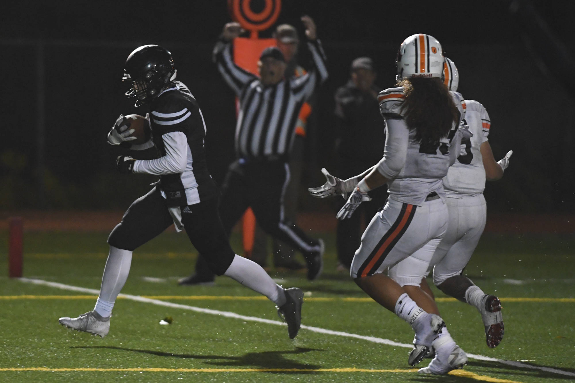 Juneau’s Cooper Kriegmont scores in the second quarter against West at Adair-Kennedy Memorial Field on Friday, Sept. 13, 2019. Kriegmont filled in at quarterback on Friday against the Colony Knights and ran for one touchdown. (Michael Penn | Juneau Empire file)