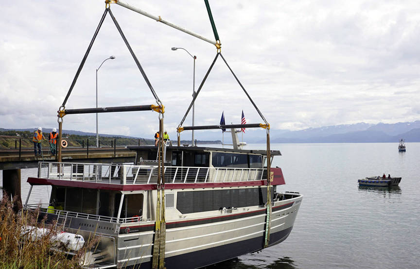 Operators of an Alaska Crane Liebherr LTM 1500 mobile hydraulic crane move the Goldbelt Seawolf at its launch on Tuesday, Sept. 10, 2019, at the Northern Enterprises Boatyard in Homer, Alaska. The crane held the Seawolf over the water until the tide had come in. (Michael Armstrong | Homer News)