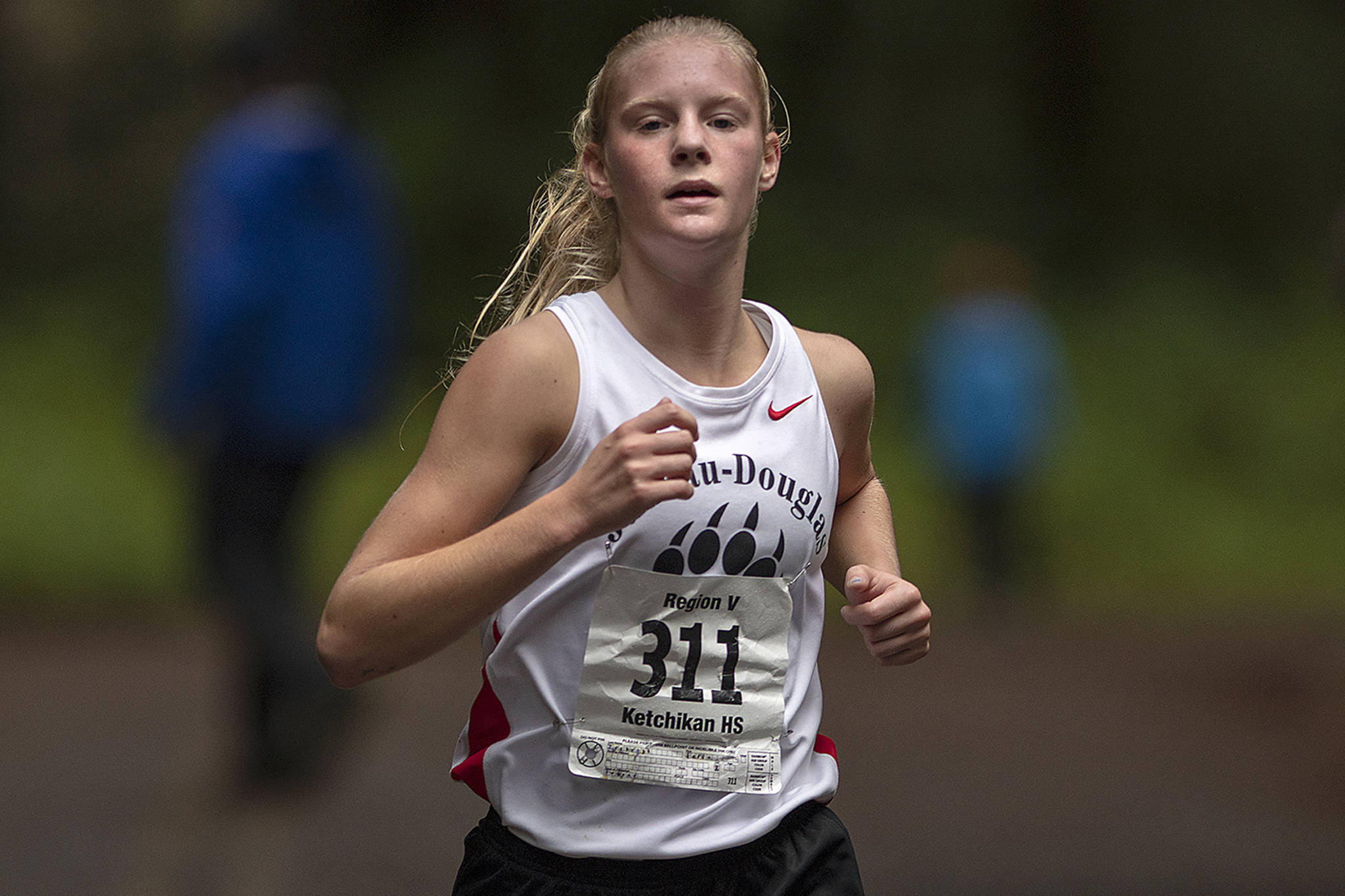 Juneau-Douglas High School senior Sadie Tuckwood runs with a big lead during the Ketchikan Invitational cross-country meet at Ward Lake in Ketchikan on Saturday, Sept. 21, 2019. Tuckwood finished first with a time of 18 minutes, 8 seconds. (Dustin Safranek | Ketchikan Daily News)