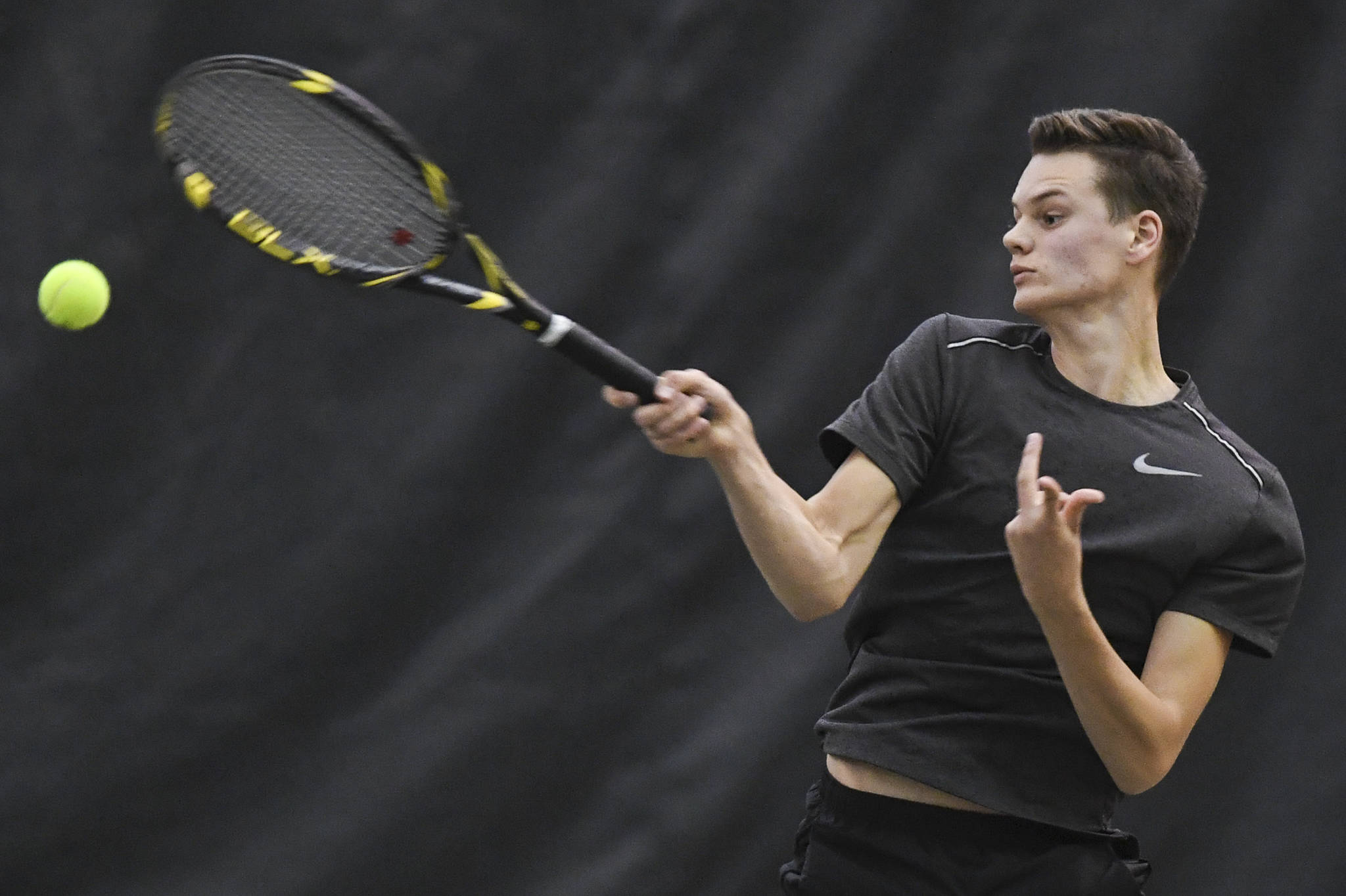 Kevin Kooistra returns a forehand as he plays doubles with partner Alain Soltys-Gray as they play against Liam Penn and Callan Smith at the Region V Tennis Tournament at the Alaska Club/JRC on Wednesday, Sept. 25, 2019. Penn and Smith won the match 6-2, 6-1, and played Will Rehfeldt and William Smoker in the final on Saturday. (Michael Penn | Juneau Empire)