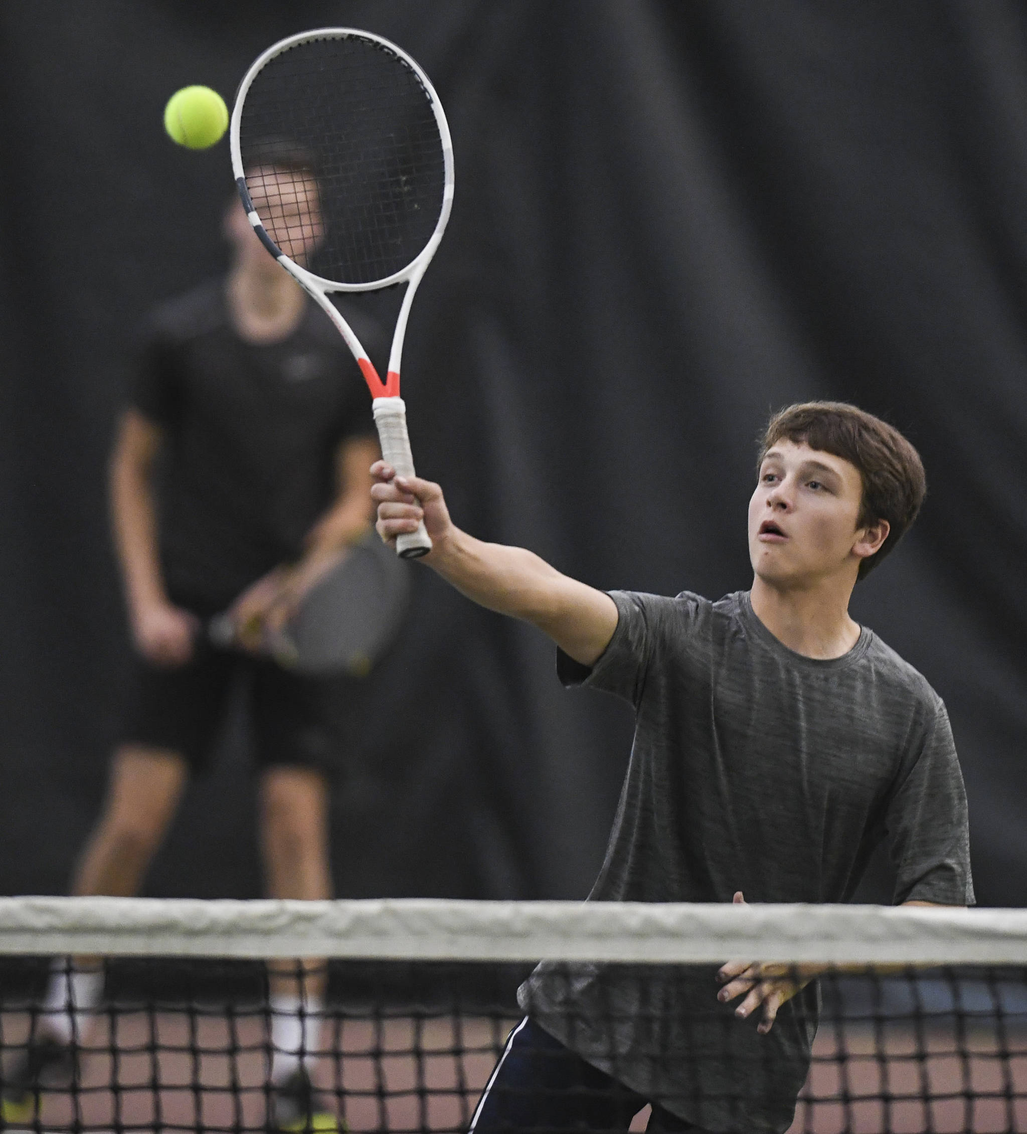 Alain Soltys returns a volley as he plays doubles with partner Kevin Kooistra as they play against Liam Penn and Callan Smith at the Regional Tennis Tournament at the Alaska Club/JRC on Wednesday, Sept. 25, 2019. Penn and Smith won the match 6-2, 6-1, and played Will Rehfeldt and William Smoker in the final on Saturday. (Michael Penn | Juneau Empire)