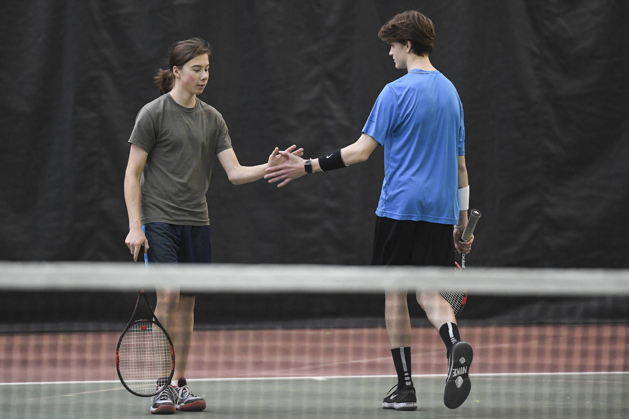 Liam Penn and Callan Smith celebrate a point against William Smoker and Will Rehfeldt in a boys doubles’ semifinal during the Region V Tennis Tournament at The Alaska Club/JRC on Saturday, Sept. 28, 2019. Smoker/Rehfeldt won 7-6, 6-2. (Michael Penn | Juneau Empire)