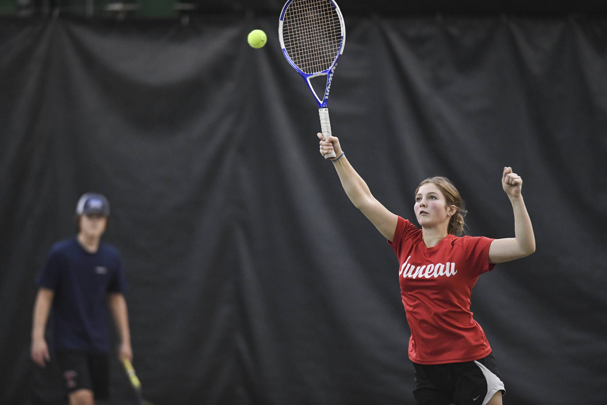 Gloria Bixby hits an overhead in the mix doubles’ consolation final with partner Reed Loree against Katie Pikul and Liam Penn during the Region V Tennis Tournament at The Alaska Club/JRC on Sunday, Sept. 29, 2019. Pikul/Penn won 8-0. (Michael Penn | Juneau Empire)