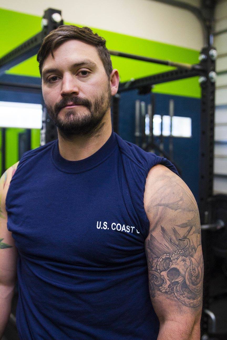 Boatswain’s Mate 2nd Class Jesse Dyals, Coast Guardsman stationed at Coast Guard Station Juneau, displays his tattoos Oct. 4, 2019. (Michael S. Lockett | Juneau Empire)