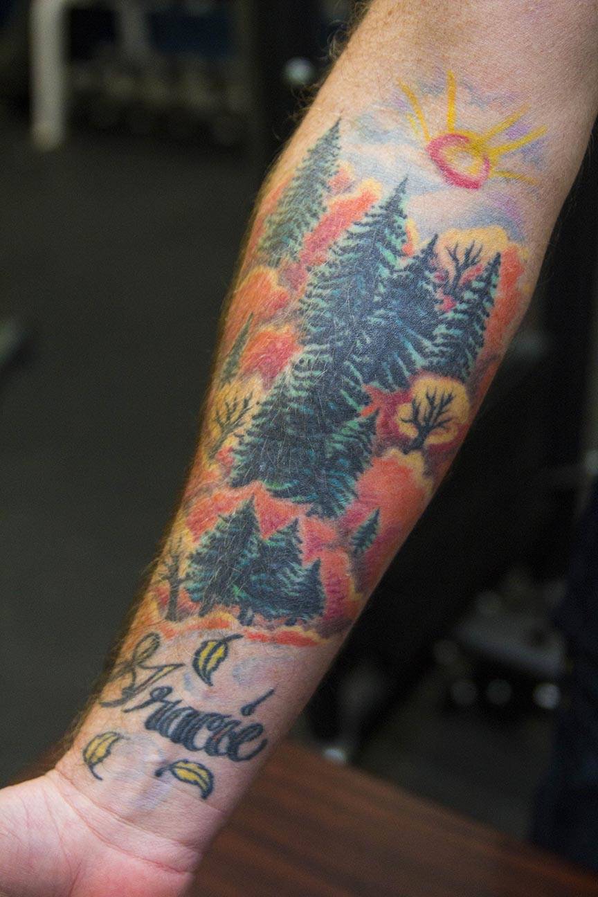 Boatswain’s Mate 1st Class Trevor Shirley, Coast Guardsman stationed at Coast Guard Station Juneau, displays his tattoos Oct. 4, 2019. (Michael S. Lockett | Juneau Empire)