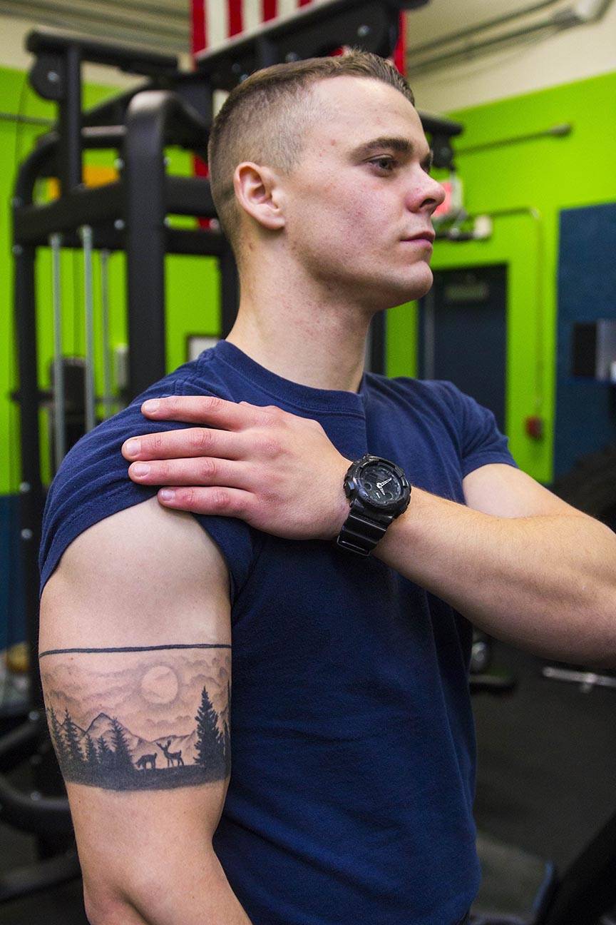 Boatswain’s Mate 3rd Class Camden Marshall, Coast Guardsman stationed at Coast Guard Station Juneau, displays his tattoos Oct. 4, 2019. (Michael S. Lockett | Juneau Empire)