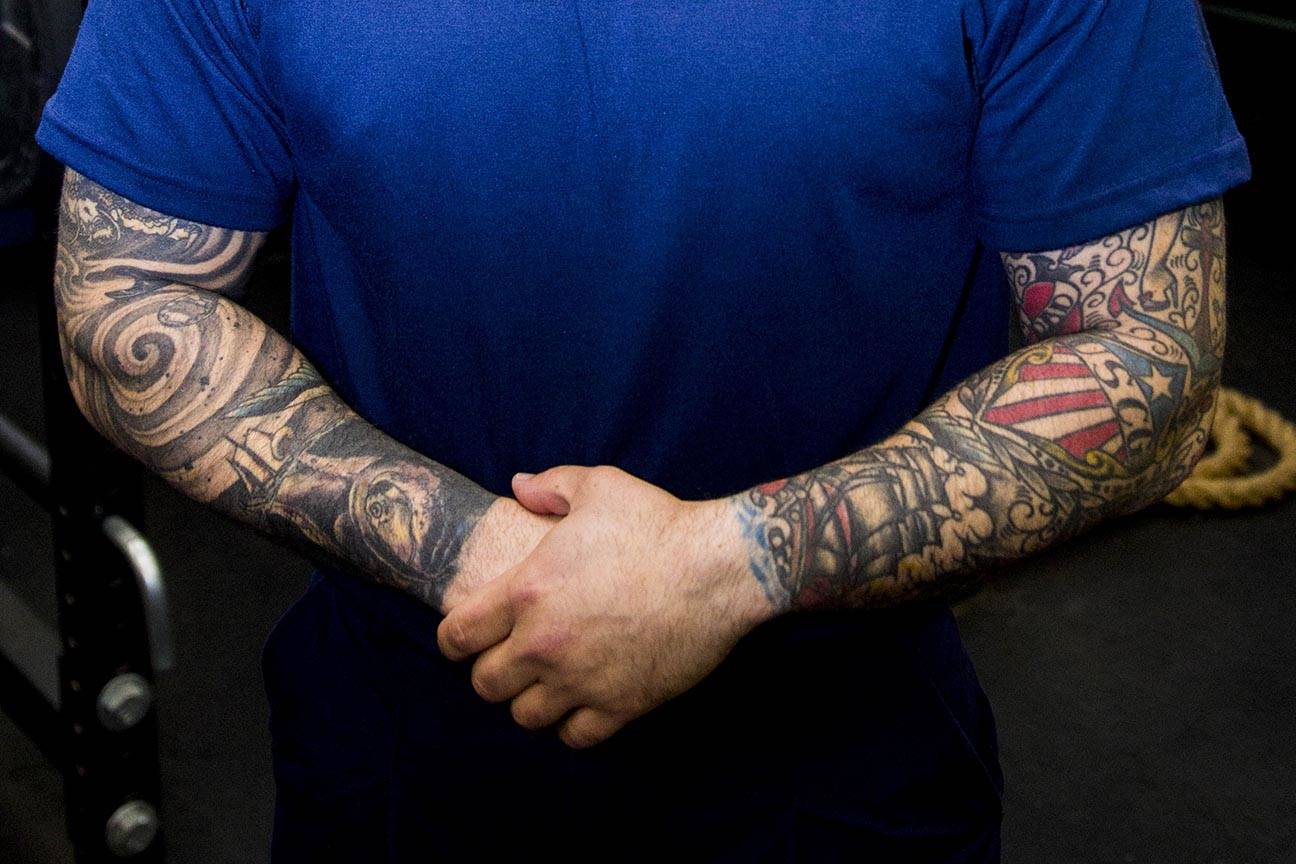 Machinery Technician 2nd Class Anthony Delorenzo, Coast Guardsman stationed at Coast Guard Station Juneau, displays his tattoos Oct. 4, 2019. (Michael S. Lockett | Juneau Empire)