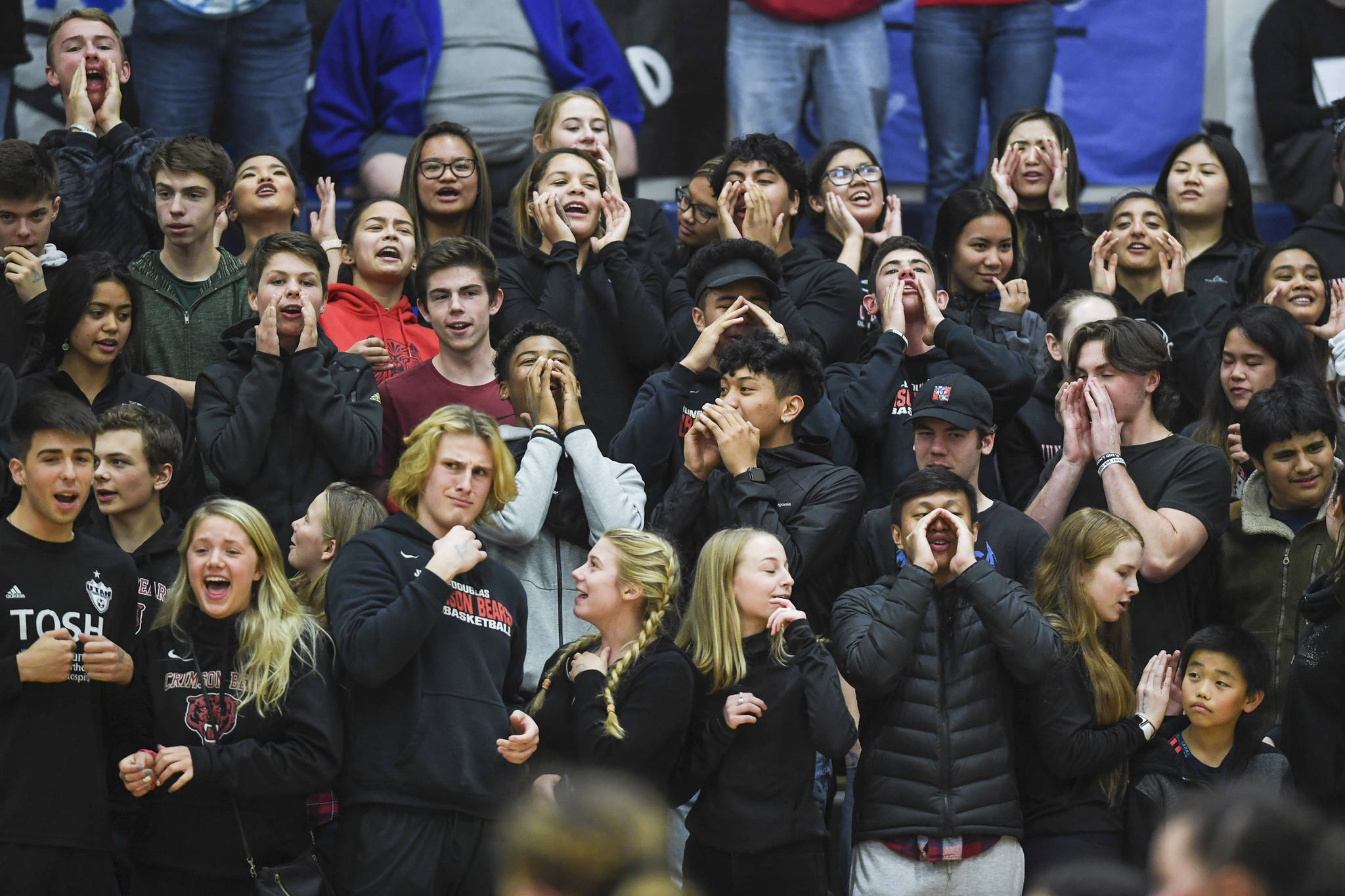 Juneau-Douglas students cheer on their team against Thunder Mountain at Thunder Mountain High School on Friday, Oct. 4, 2019. (Michael Penn | Juneau Empire)