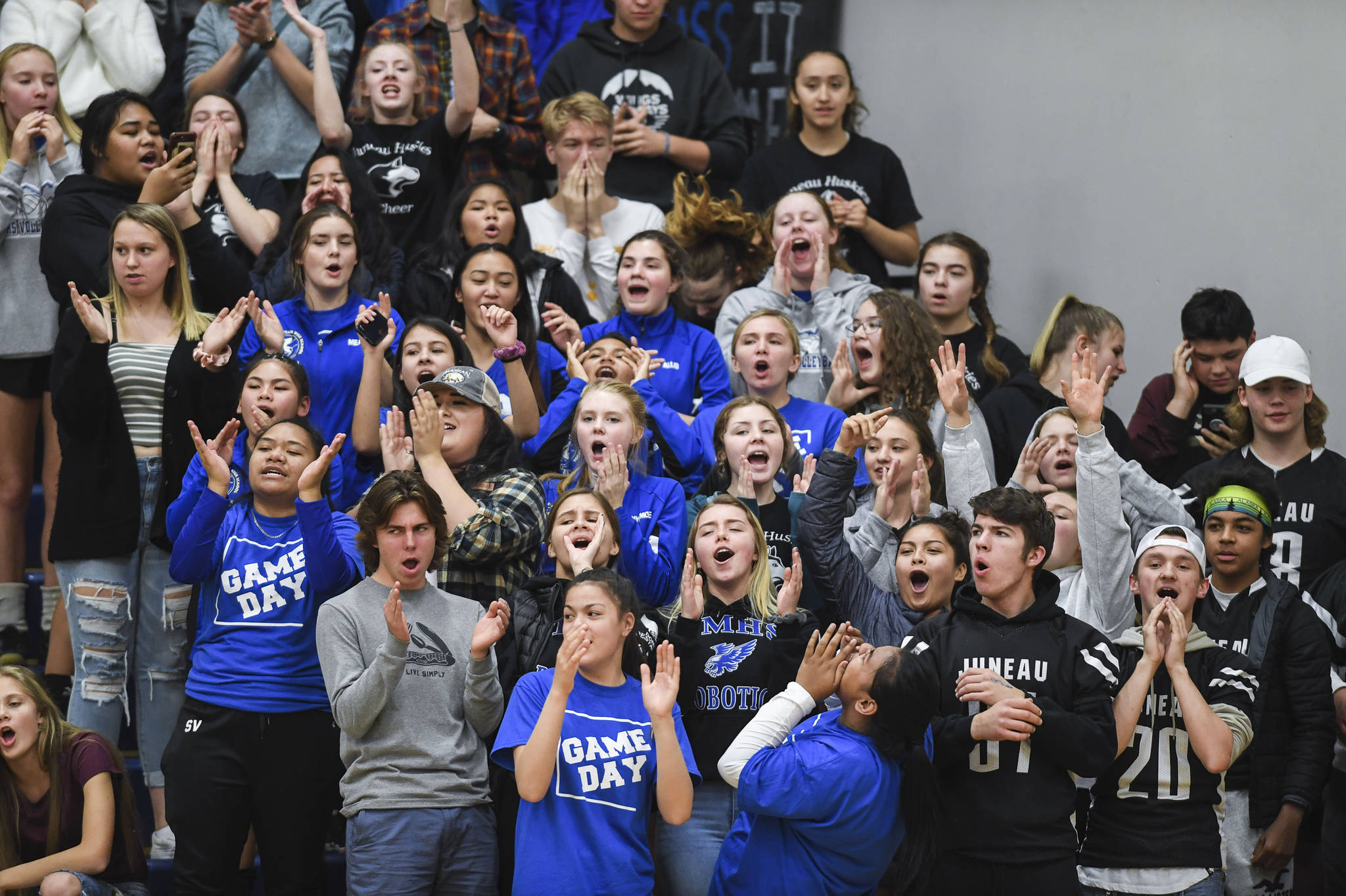 Thunder Mountain students cheer on their team against Juneau-Douglas at Thunder Mountain High School on Friday, Oct. 4, 2019. (Michael Penn | Juneau Empire)