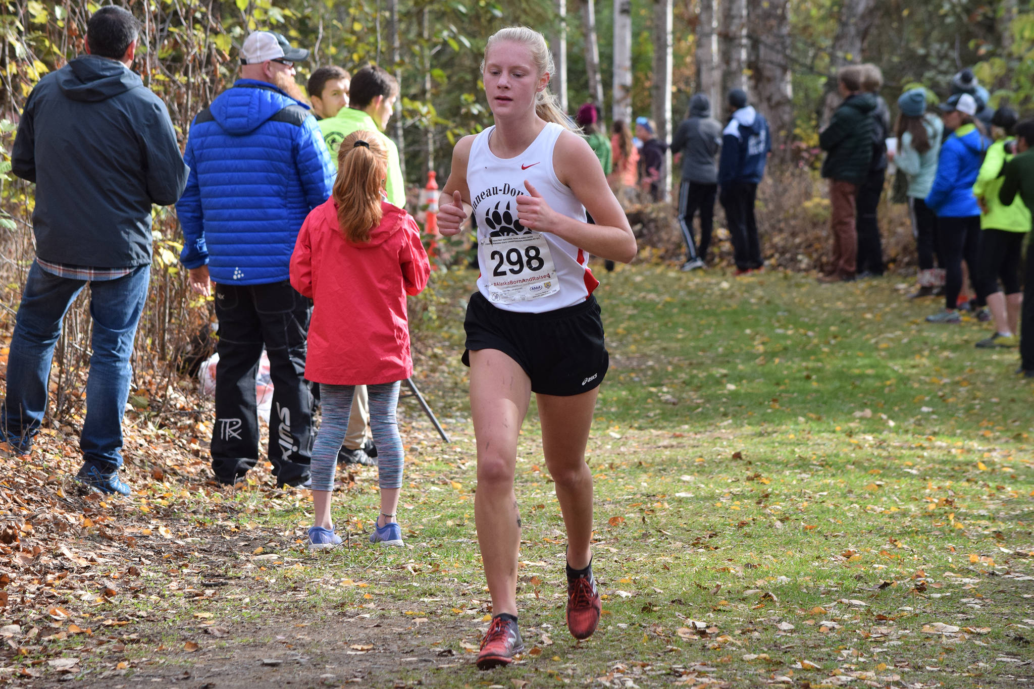 Juneau-Douglas High School: Yadaat.at Kalé senior Sadie Tuckwood races in second place in the ASAA Division I girls cross country championships at Bartlett High School on Saturday, Oct. 5, 2019. Tuckwood took second overall with a time of 18:13. (Nolin Ainsworth | Juneau Empire)