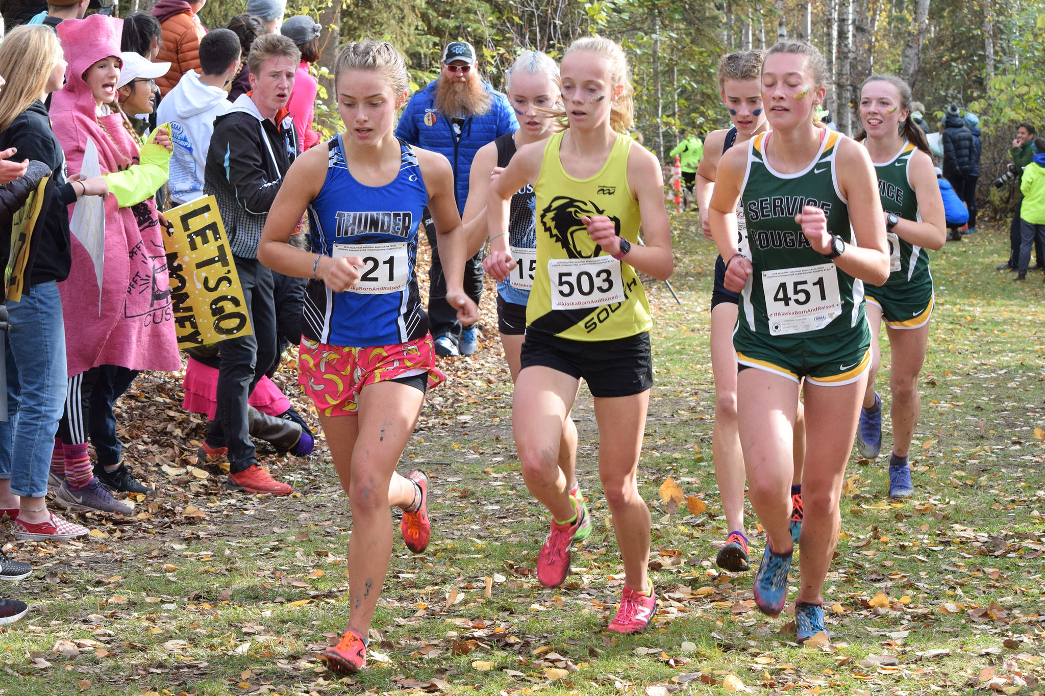 Thunder Mountain High School sophomore Kiah Dihle, left, leads a pack of runners in the ASAA Division I girls cross country championships at Bartlett High School on Saturday, Oct. 5, 2019. Dihle took eighth overall with a time of 19:10. (Nolin Ainsworth | Juneau Empire)