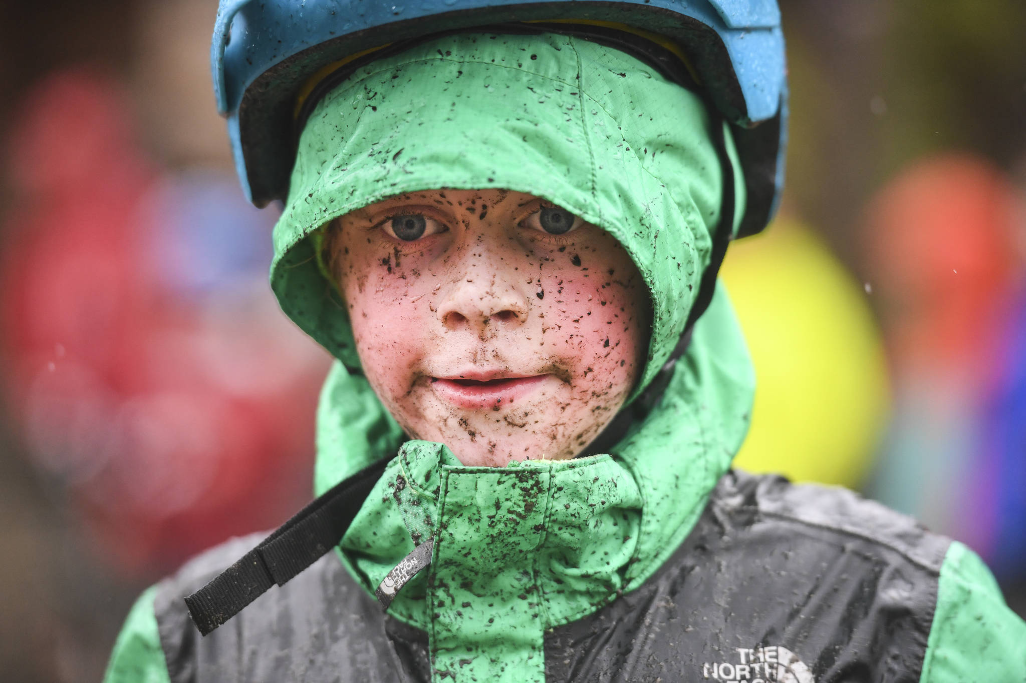 Mud splatters across the face of Alexander Andrews, 7, as he finishes second in the Douglas Dirt Derby Youth Bike Race for 5 to 7-year-olds at Savikko Park and the Treadwell Mine Historic Trail on Saturday, Oct. 5, 2019. The event was organized by the Juneau Freewheelers Bicycle Club. (Michael Penn | Juneau Empire)