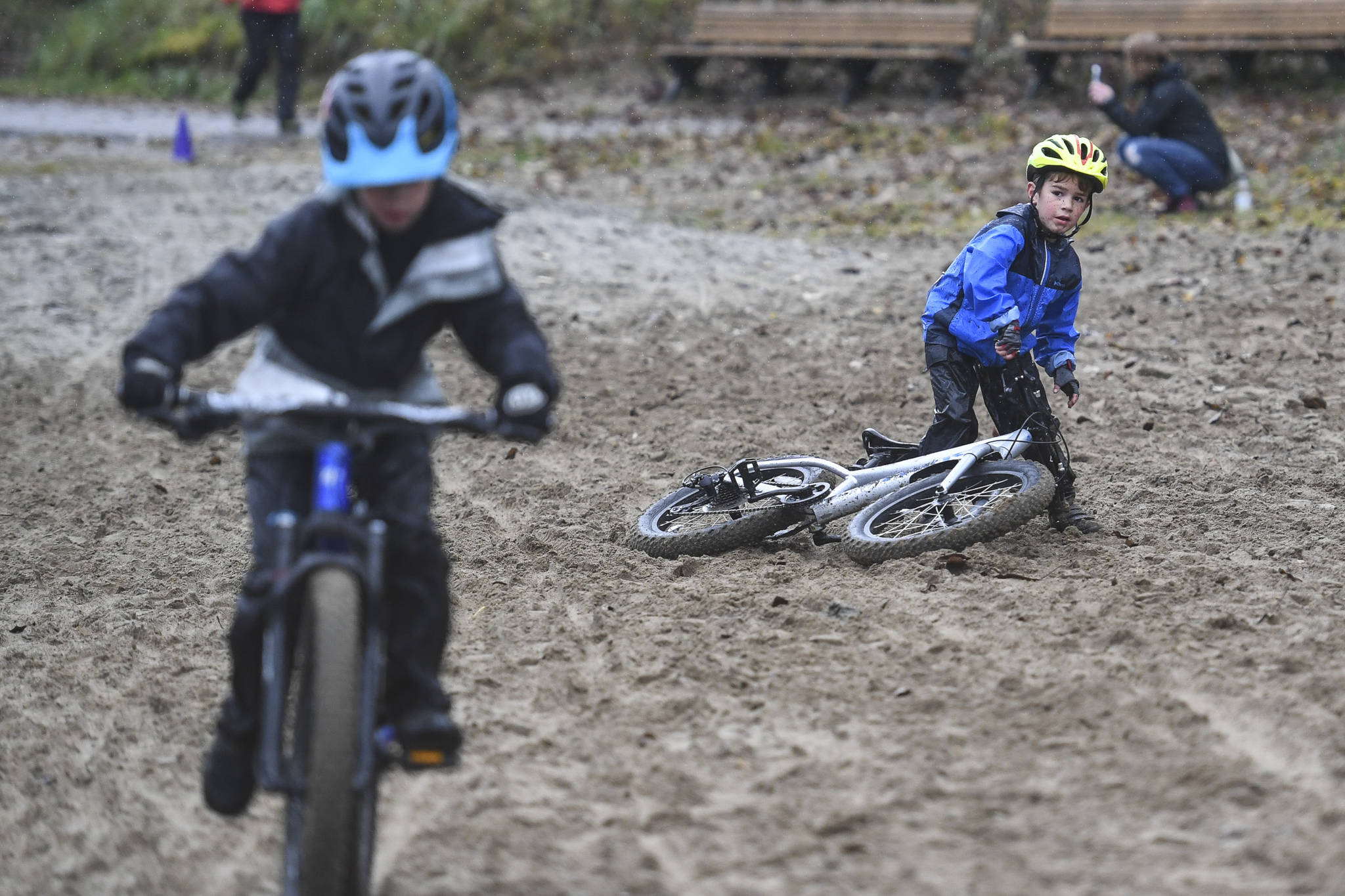 Pearson Fagel, 6, takes a spill at the finish of the Douglas Dirt Derby Youth Bike Race for 5 to 7-year-olds at Savikko Park and the Treadwell Mine Historic Trail on Saturday, Oct. 5, 2019. The event was organized by the Juneau Freewheelers Bicycle Club. (Michael Penn | Juneau Empire)