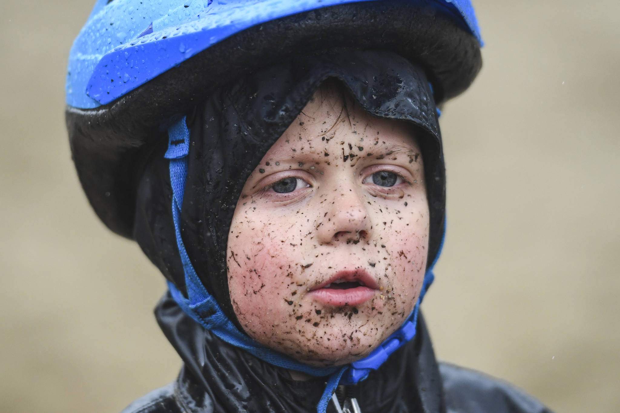 Teller Buchmiller, 6, finishes in the Douglas Dirt Derby Youth Bike Race for 5 to 7-year-olds with a mud splattered face at Savikko Park and the Treadwell Historic Trail on Saturday, Oct. 5, 2019. The event was organized by the Juneau Freewheelers Bicycle Club. (Michael Penn | Juneau Empire)
