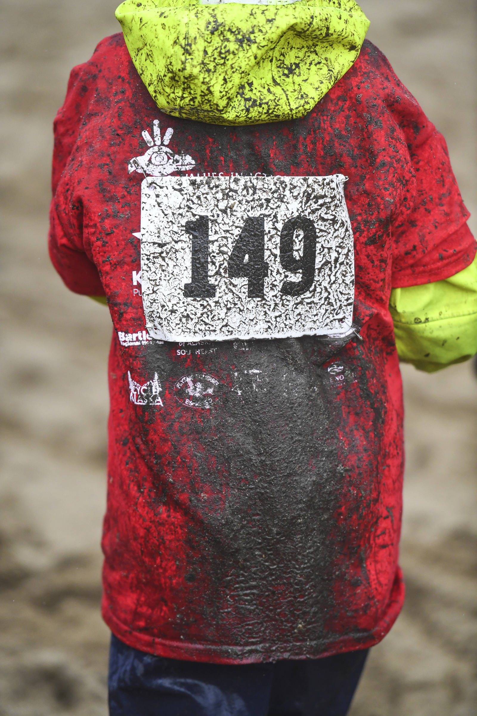 Mud splatters the backside of a rider at the Douglas Dirt Derby Youth Bike Race for 5 to 7-year-olds at Savikko Park and the Treadwell Historic Trail on Saturday, Oct. 5, 2019. The event was organized by the Juneau Freewheelers Bicycle Club. (Michael Penn | Juneau Empire)