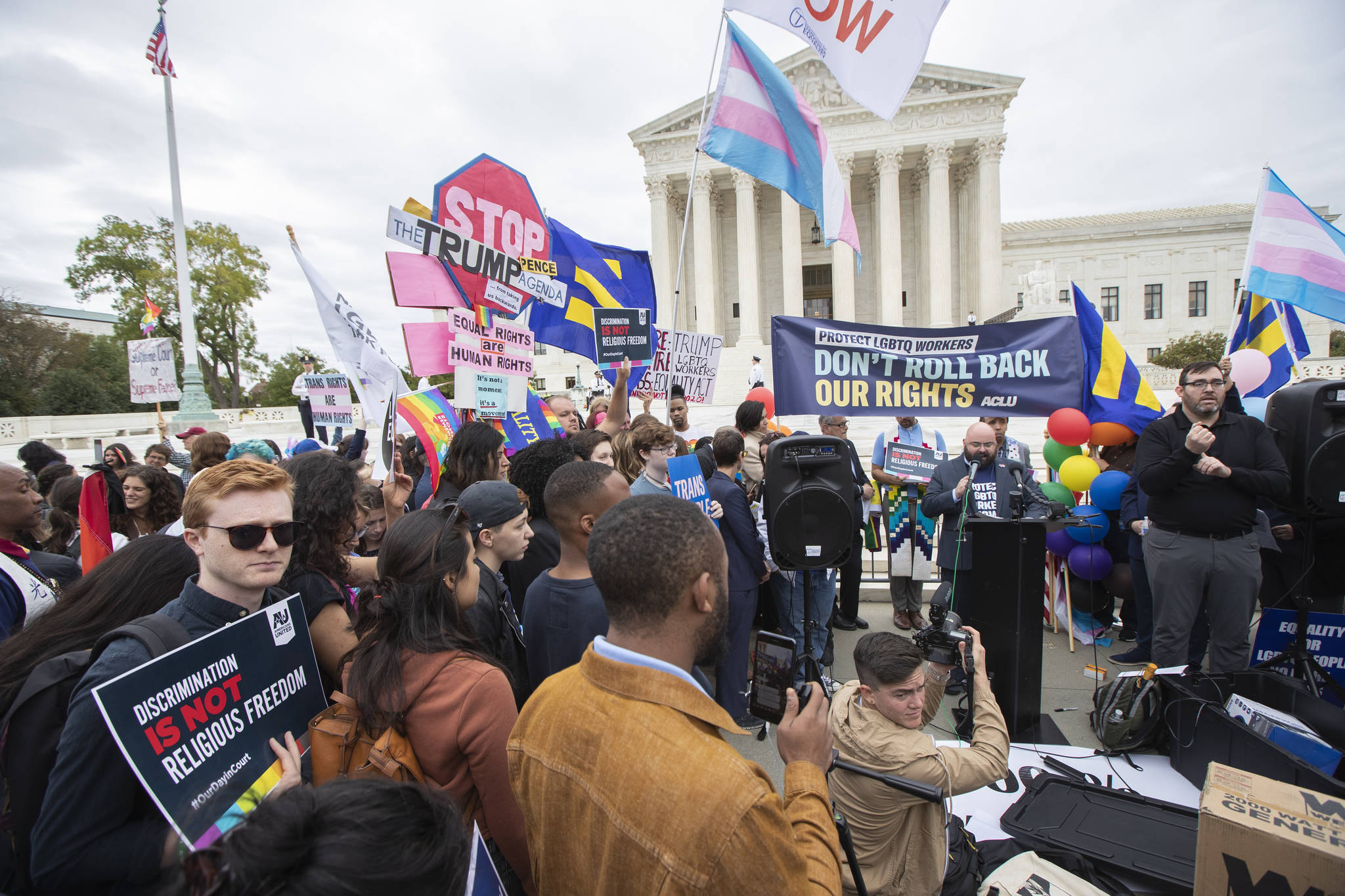 LGBT supporters gather in front of the U.S. Supreme Court, Tuesday, Oct. 8, 2019, in Washington. The Supreme Court is set to hear arguments in its first cases on LGBT rights since the retirement of Justice Anthony Kennedy. Kennedy was a voice for gay rights while his successor, Brett Kavanaugh, is regarded as more conservative. (AP Photo/Manuel Balce Ceneta)