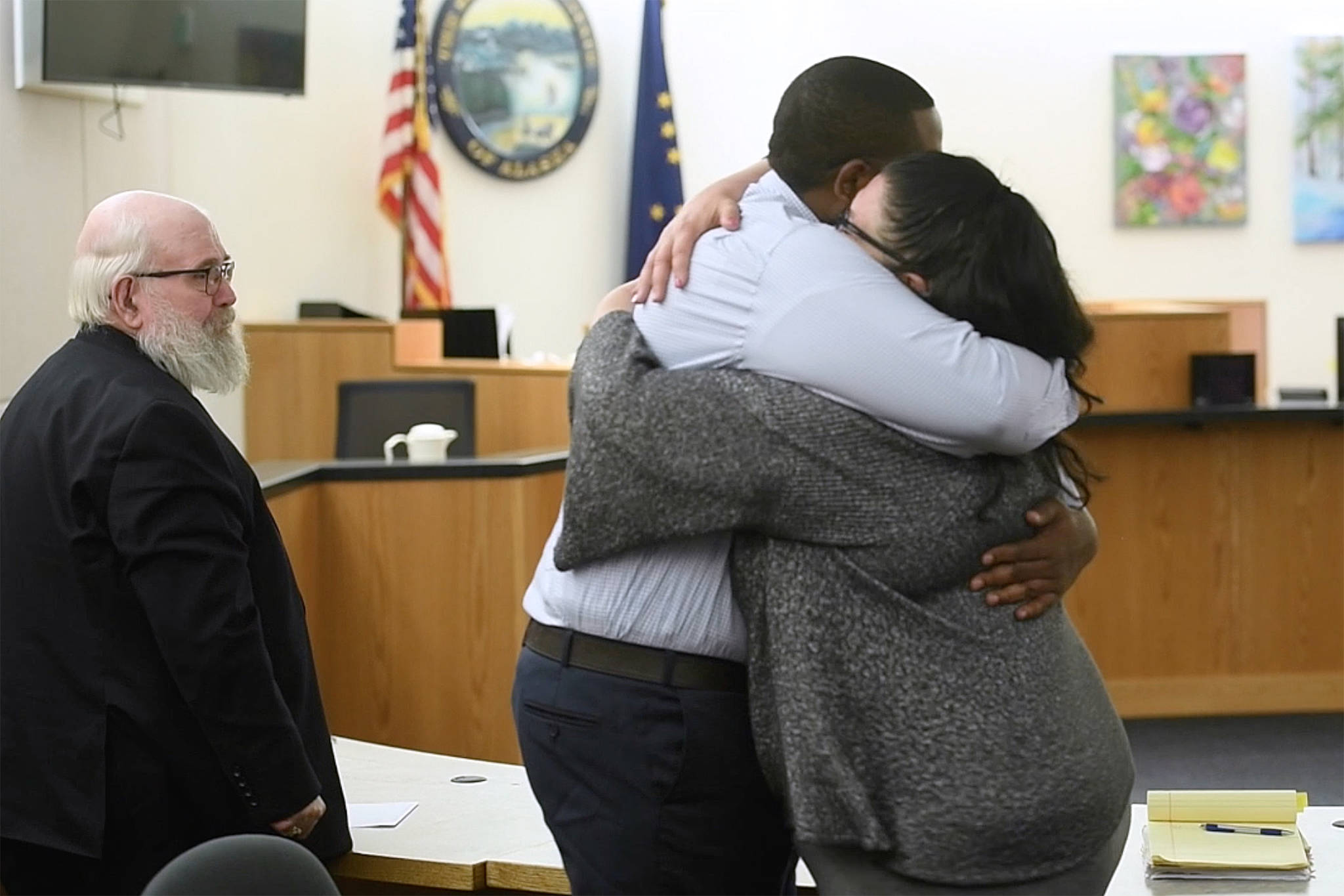 Laron Carlton Graham hugs his defense attorney Natasha Norris after a jury found him not guilty for the November 2015 shooting deaths of 36-year-old Robert H. Meireis and 34-year-old Elizabeth K. Tonsmeire in Juneau Superior Court on Tuesday, Oct. 8, 2019. (Michael Penn | Juneau Empire)
