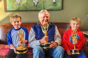 Wayne Fitzgerald, prolific and prodigious title sequence designer, is flanked by his grandsons, Bodhi and Portern Nelson of Juneau. All three hold awards earned by the late Fitzgerald over the course of his long career. (Courtesy Photo | Courtney Mico-Nelson)