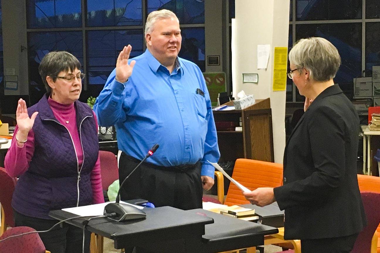 Emil Mackey and Deedie Sorensen are sworn in as members of the Juneau Board of Education following last week’s election on Oct. 8, 2019. (Michael S. Lockett | Juneau Empire)