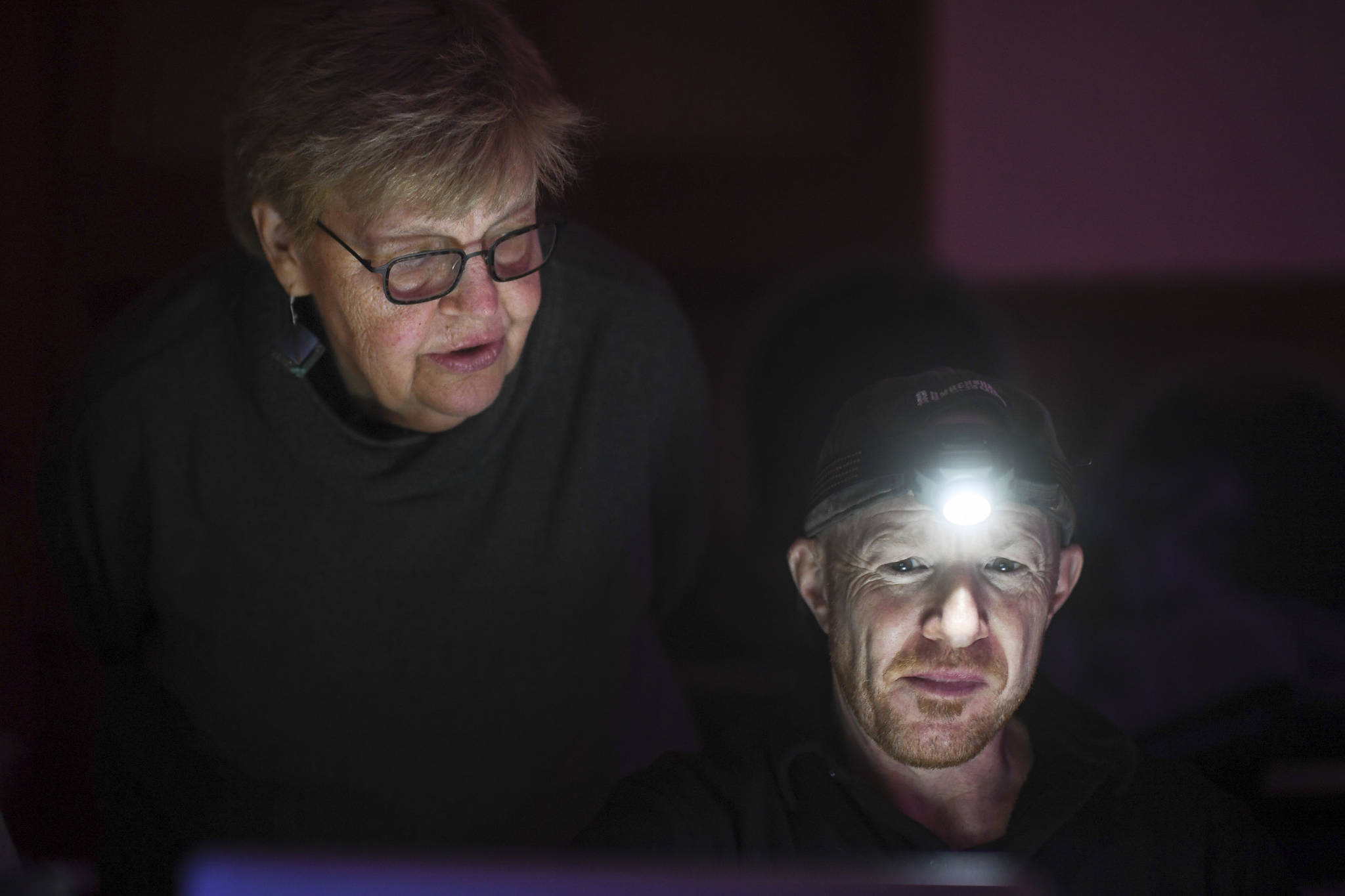 Playwright Maureen Longworth, left, and director Roblin Gray Davis work on the production of “Blue Ticket” at McPhetres Hall on Tuesday, Oct. 15, 2019. (Michael Penn | Juneau Empire)