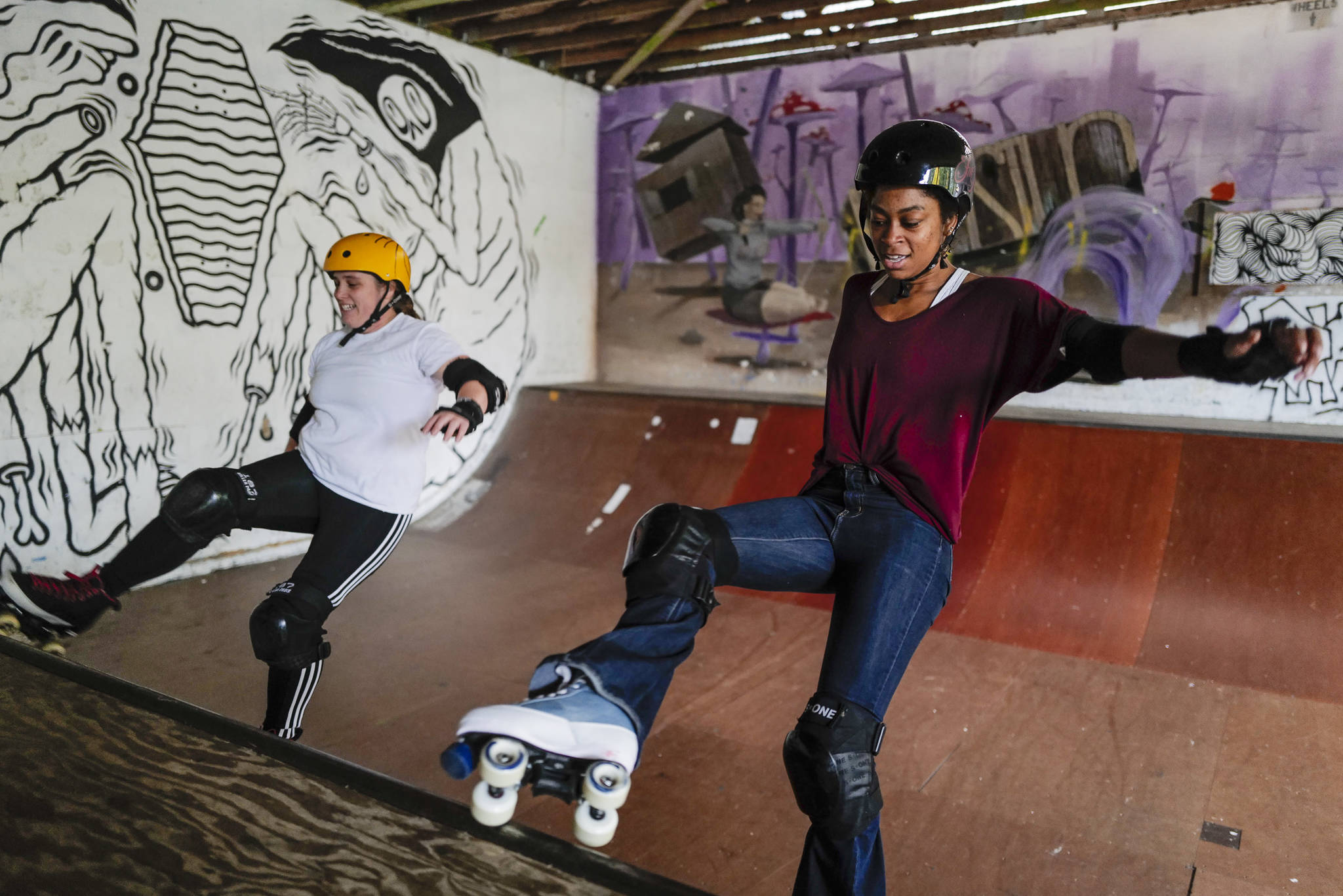 Jennifer Gross and Shabadrang Khalsa, who skate with the Juneau Rollergirls, get their daily skate in at the Pipeline Skate Park on Friday, Oct. 11, 2019. The two are skating everyday as part of a challenge to everyday for a year. (Michael Penn | Juneau Empire)