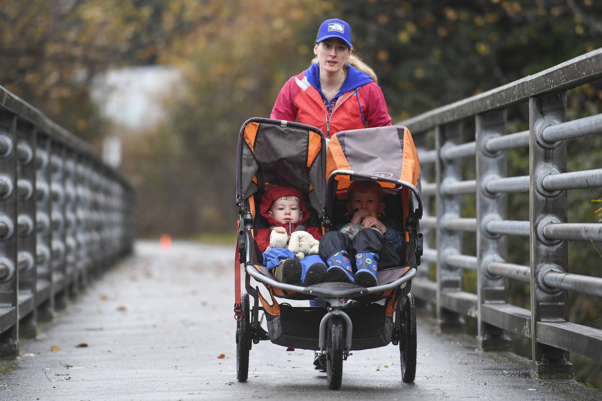 Crystal Schmitz participates with her young children in the annual community mental health run, the Extra Tough 5K & 1 Mile Run, on Saturday, Oct. 12, 2019, starting at Riverbend Elementary School. The run is sponsored by National Alliance on Mental Illness (NAMI) Juneau. (Michael Penn | Juneau Empire)