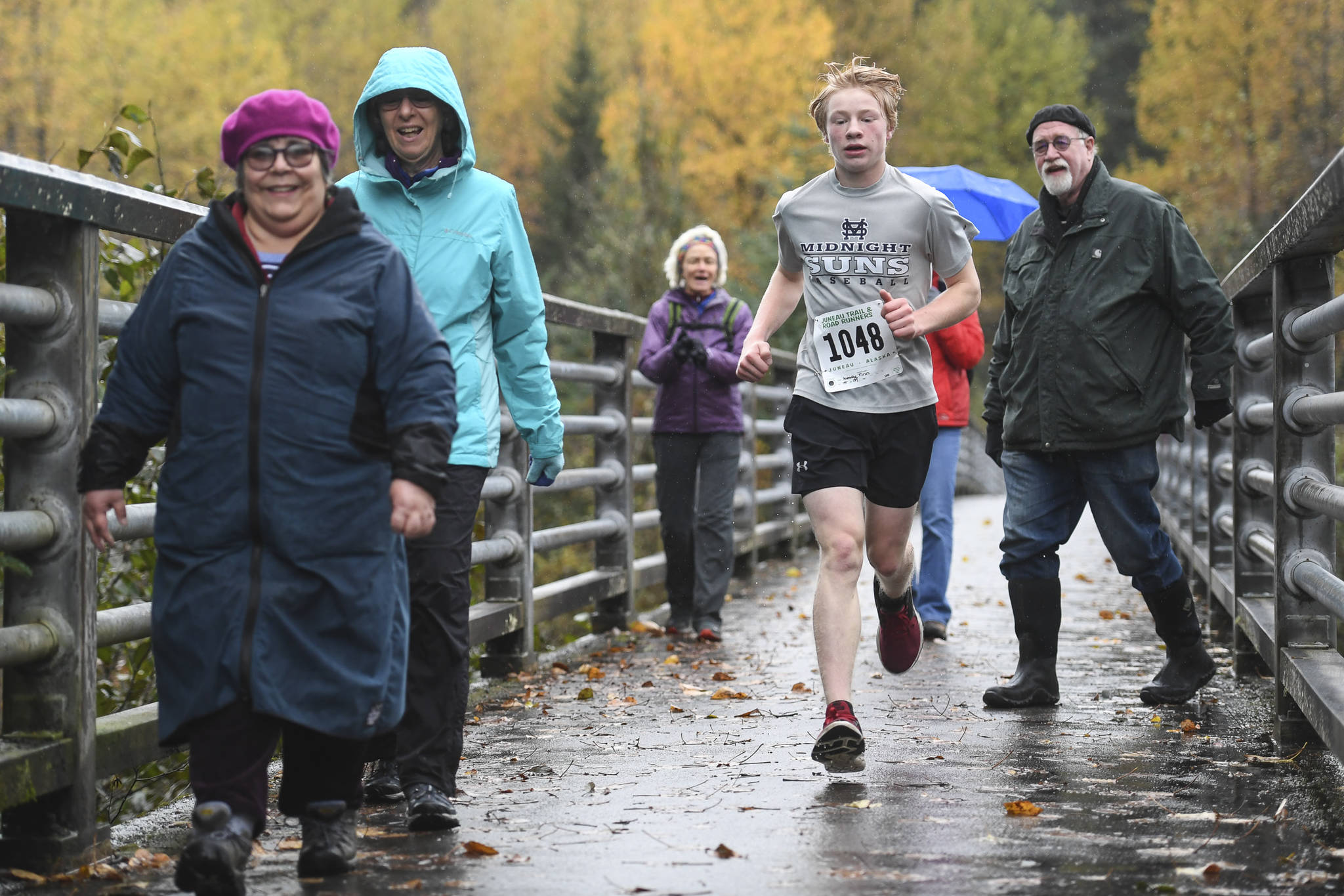 Finn Kesey runs in the annual community mental health run, the Extra Tough 5K & 1 Mile Run, on Saturday, Oct. 12, 2019, at Riverbend Elementary School. The run is sponsored by National Alliance on Mental Illness (NAMI) Juneau. (Michael Penn | Juneau Empire)