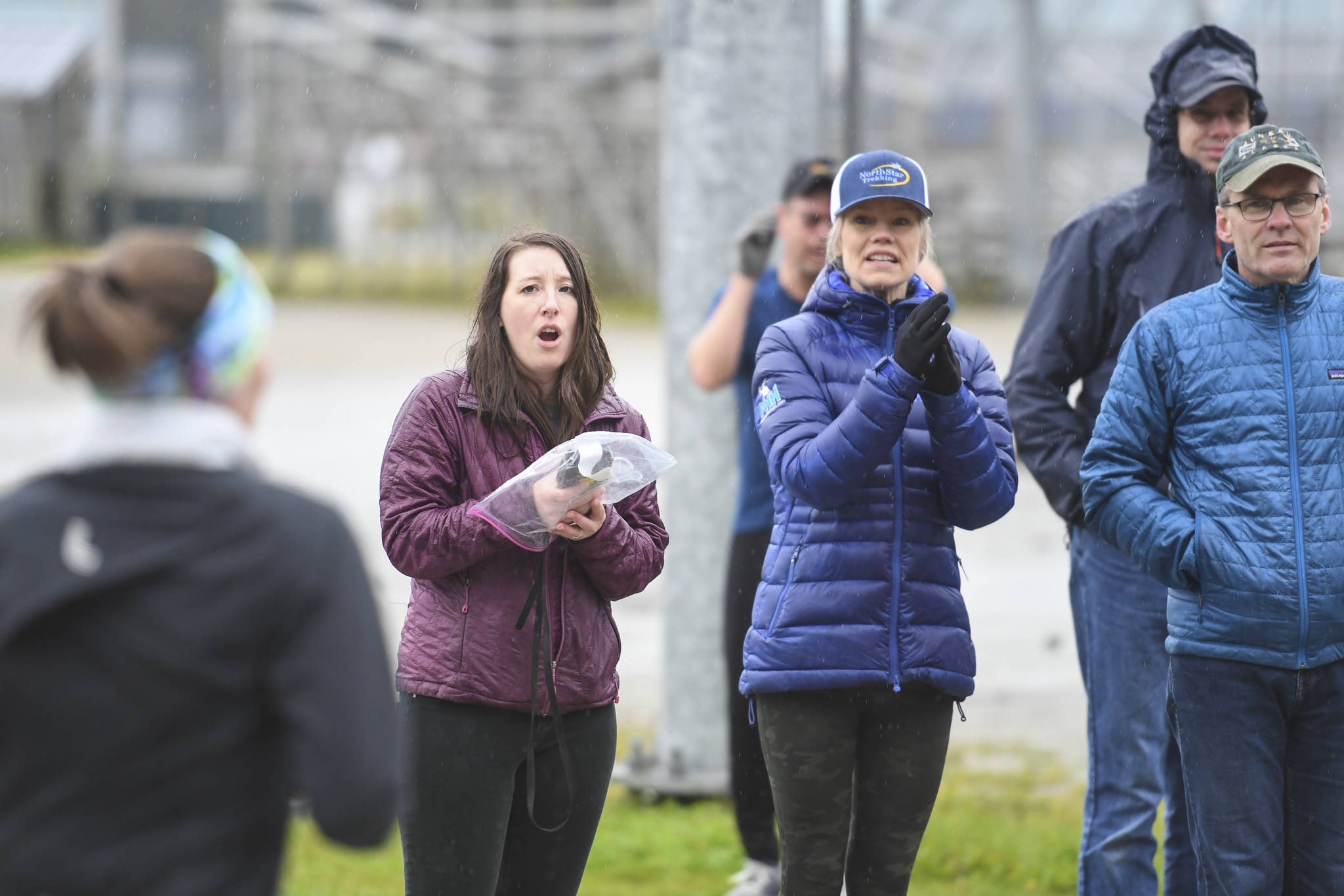Crystal Bourland, Executive Director of the National Alliance on Mental Illness (NAMI) Juneau, left, cheers and keeps time during the annual community mental health run, the Extra Tough 5K & 1 Mile Run, on Saturday, Oct. 12, 2019, at Riverbend Elementary School. The run is sponsored by National Alliance on Mental Illness (NAMI) Juneau. (Michael Penn | Juneau Empire)