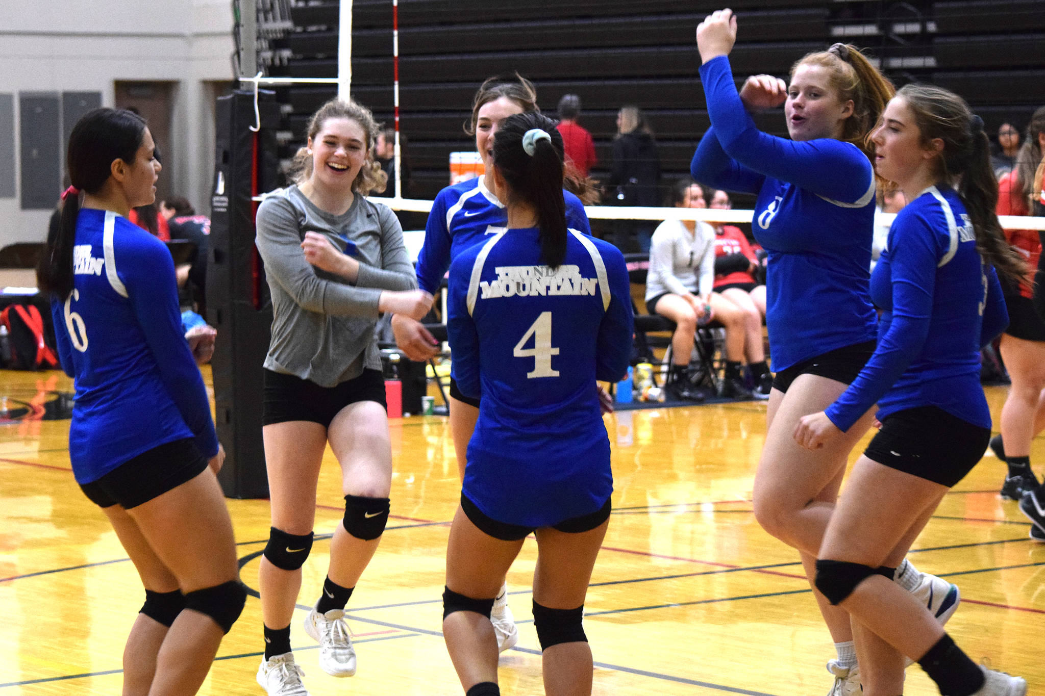 Thunder Mountain High School celebrates a point against Klawock at the JIVE (Juneau Invitational Volleyball Extravaganza) Tournament at Juneau-Douglas High School: Yadaat.at Kalé on Friday, Oct. 11, 2019. (Nolin Ainsworth | Juneau Empire)