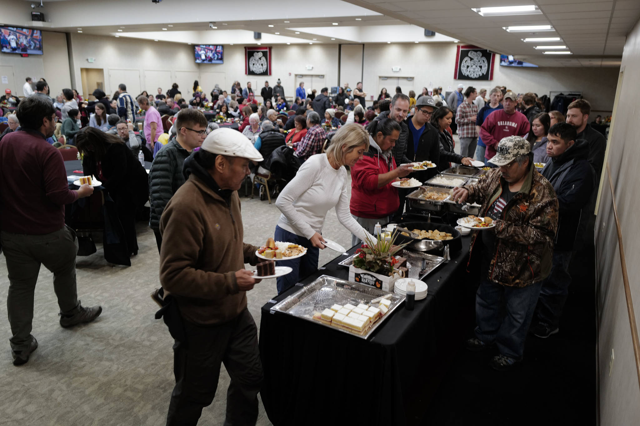 People crowd into the Elizabeth Peratrovich Hall for lunch during Indigenous Peoples’ Day on Monday, Oct. 14, 2019. (Michael Penn | Juneau Empire)