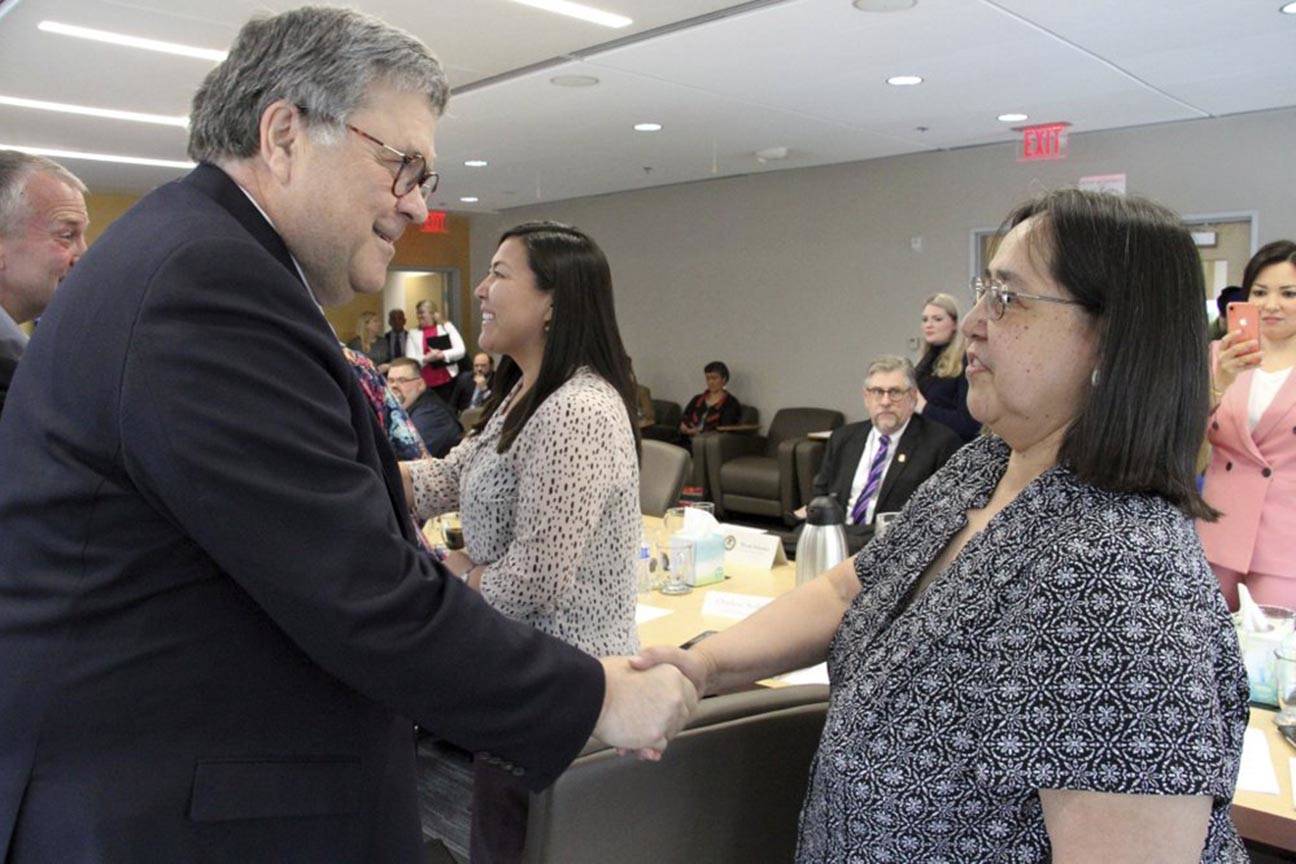 U.S. Attorney General William Barr, left, greets Vivian Korthius with the Association of Village Council Presidents at a roundtable discussion at the Alaska Native Tribal Health Consortium on Wednesday, May 29, 2019, in Anchorage, Alaska, where participants discussed public safety concerns in rural Alaska. (AP Photo/Mark Thiessen)
