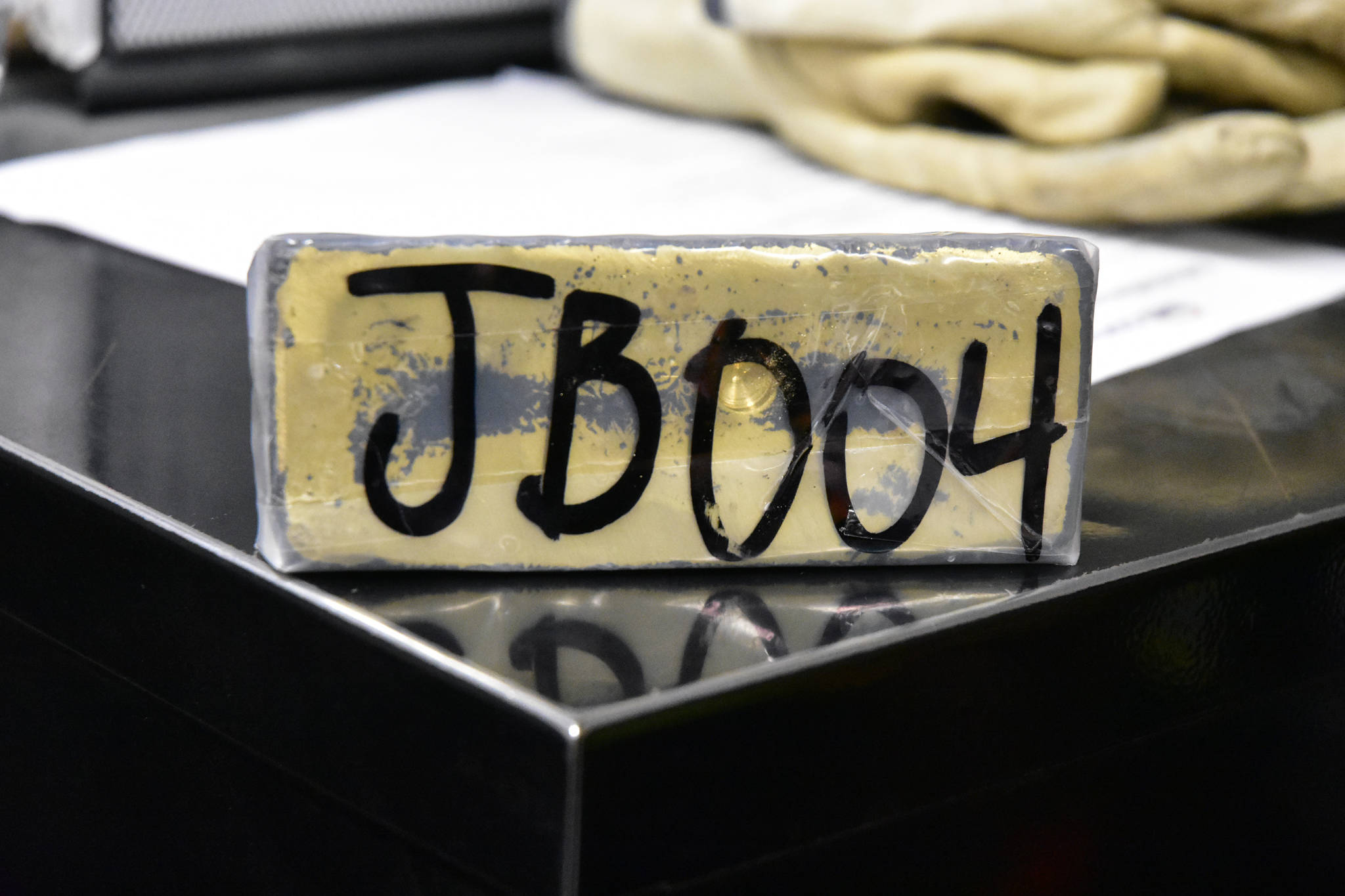 A gold bar worth roughly $100,000, according to Kensington Mine staff on Monday, Oct. 14, 2019. (Peter Segall | Juneau Empire)