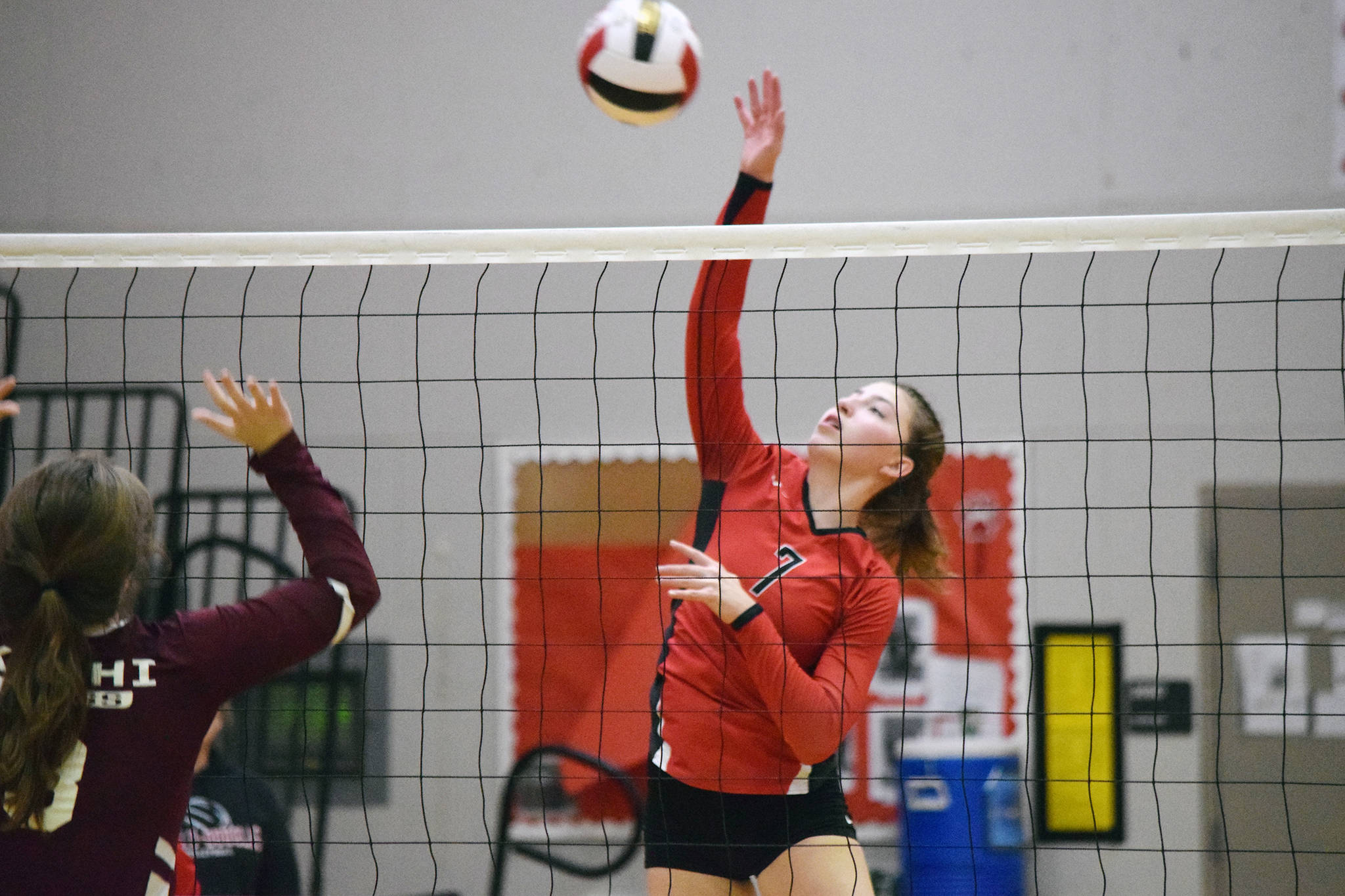 Juneau-Douglas: Yadaat.at Kale junior Jojo Griggs hits the ball over the net while playing against Ketchikan at JDHS on Saturday, Oct. 19, 2019. (Nolin Ainsworth | Juneau Empire)