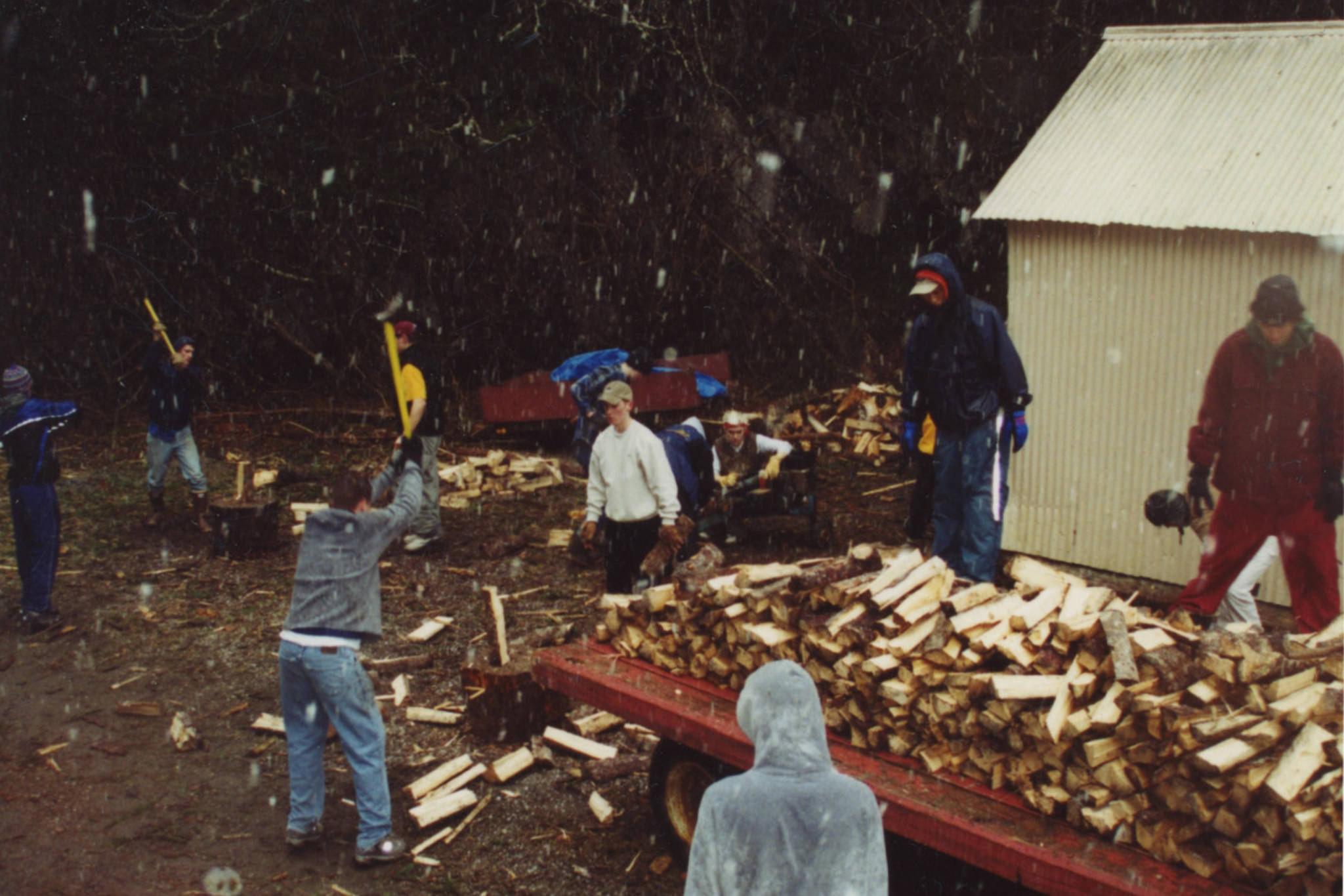 The Juneau-Douglas High School boys soccer team cuts firewood for a team fundraiser Out The Road in 2000. (Courtesy Photo | Gary Lehnhart)