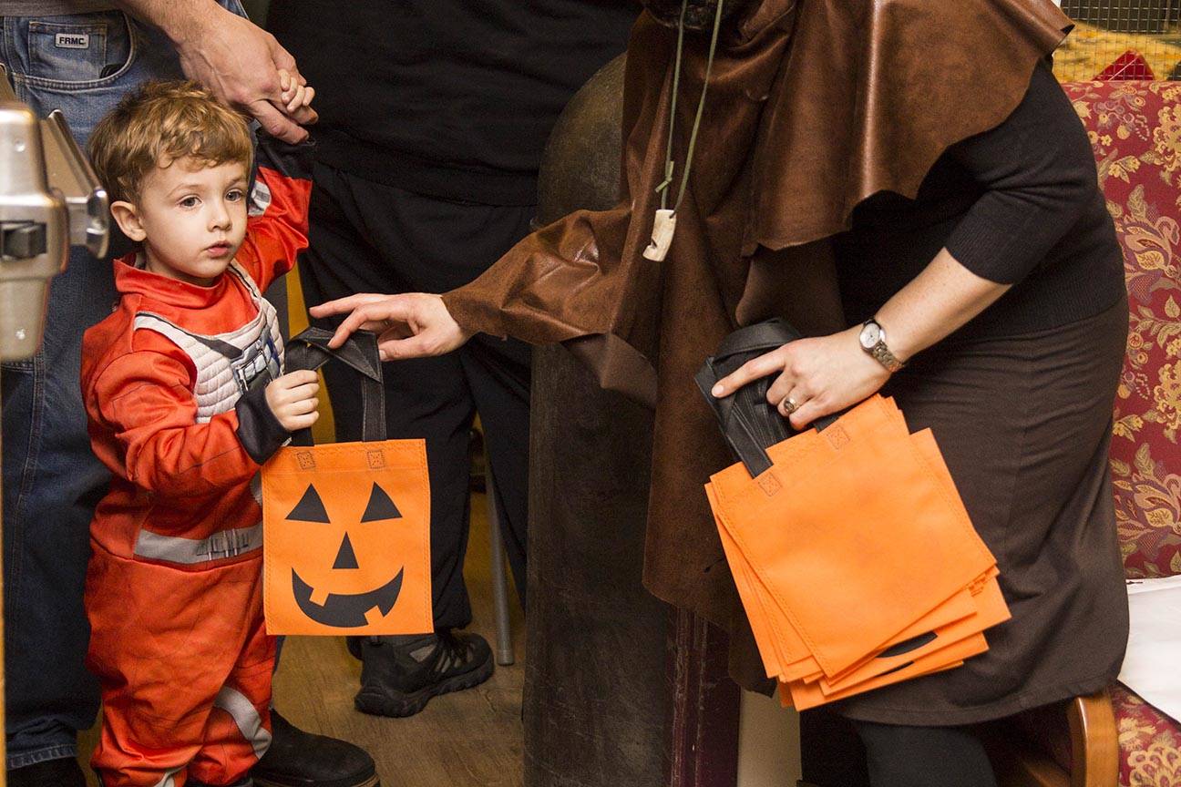 Elliot, 2, prepares to go trick-or-treating as members of the Parents as Teachers program and a number of children visited the Juneau Pioneer Home to have an early Halloween with the residents on Tuesday, Oct. 22, 2019. (Michael S. Lockett | Juneau Empire)