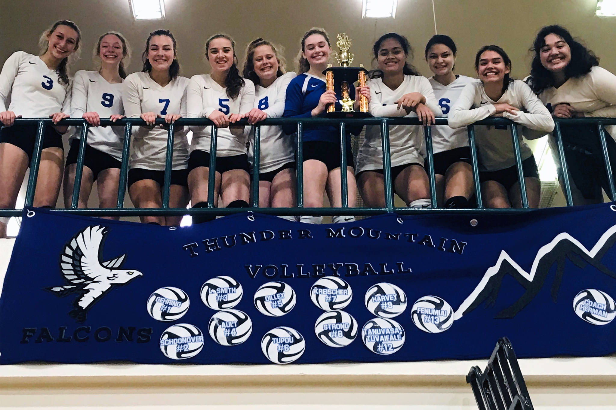 The Thunder Mountain High School volleyball team poses with the Dimond Service Volleyball Tournament Silver Bracket championship trophy at Service High School on Saturday, Oct. 26, 2019. The Falcons defeated West Valley High School 2-1 (21-25, 26-24, 15-12) to win the title at the tournament hosted by Service and Dimond high schools of Anchorage. (Courtesy Photo | Julie Herman)