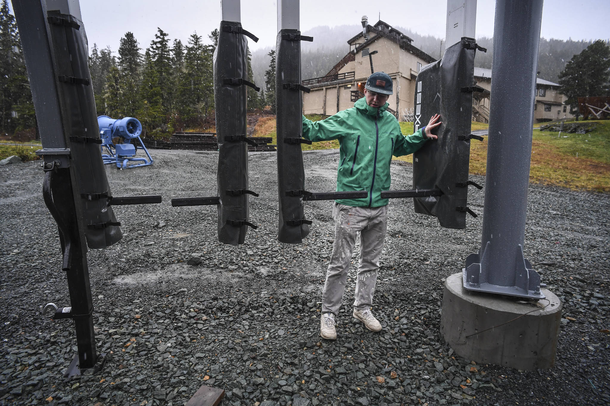 Charlie Herrington, Marketing Manager for the Eaglecrest Ski Area, shows off new radio-frequency identification gates on Tuesday, Oct. 29, 2019, that skiers will use this season to access the chairlifts. (Michael Penn | Juneau Empire)