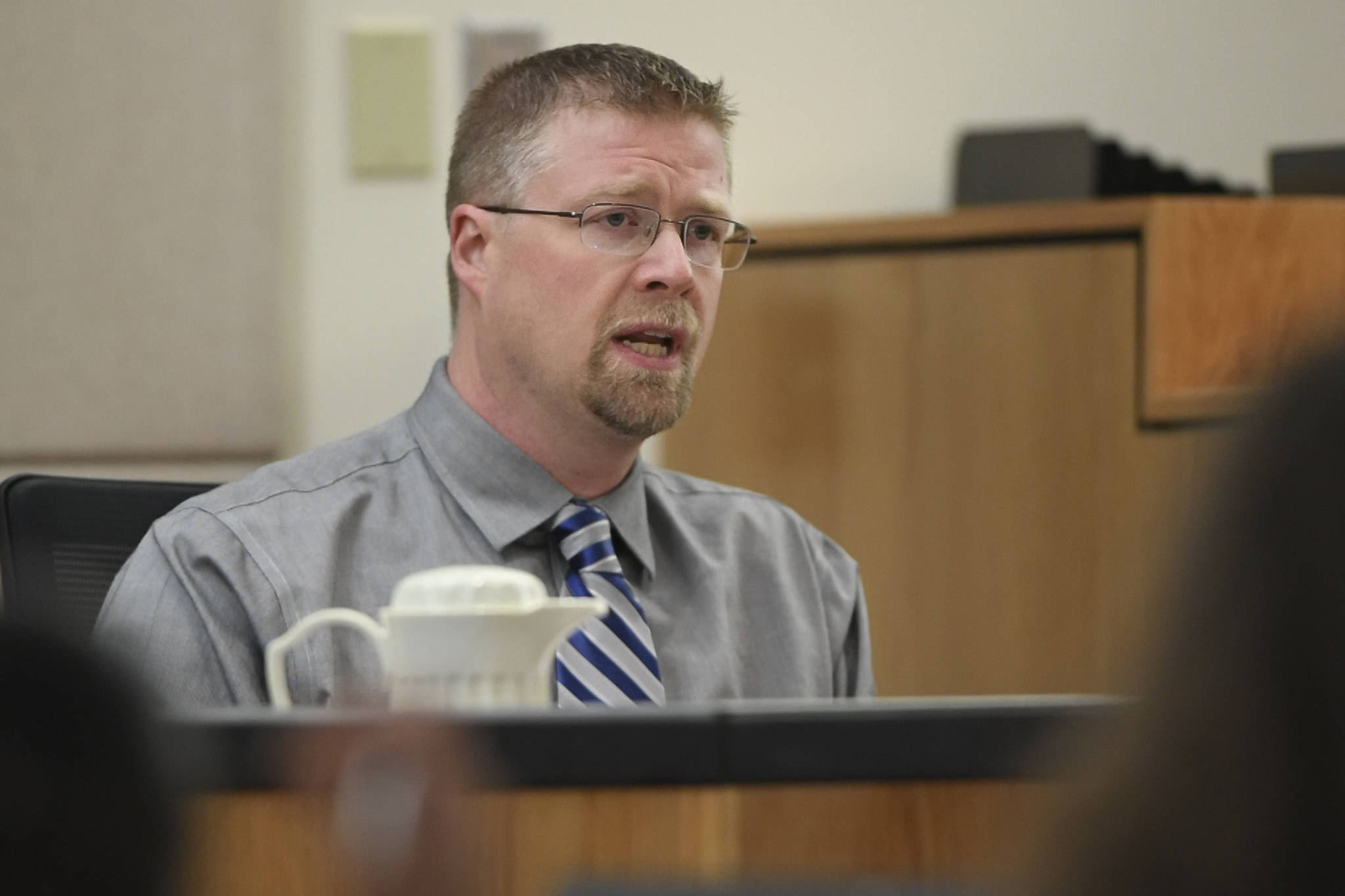 Nate Imes, an investigator with the Alaska Department of Revenue, speaks from the witness stand during the trial of Loretto Lee Jones in Juneau Superior Court on Thursday, Oct. 31, 2019. Jones is on trial for Alaska Permanent Fund Dividend felony theft and fraud. The two charges stem from allegations that Jones filed for her PFD payout in 2016 while having resided outside the state for more than 180 days. (Michael Penn | Juneau Empire)