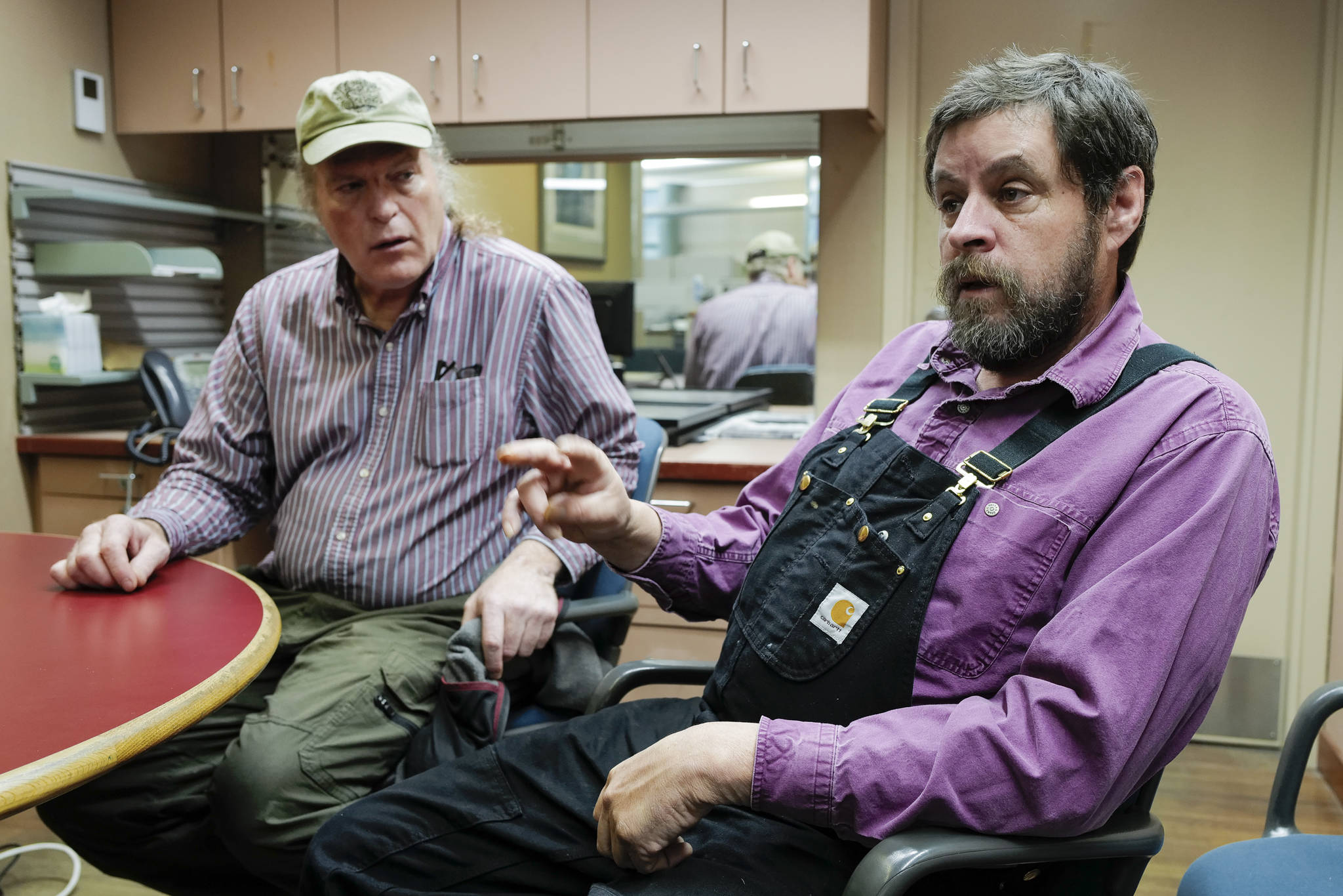 Joe Emerson, left, and Keith Heller, of Shoreline Wild Salmon, talk Thursday, Oct. 31, 2019, about their new business delivering troll-caught salmon to both local and out-of-state markets. (Michael Penn | Juneau Empire)