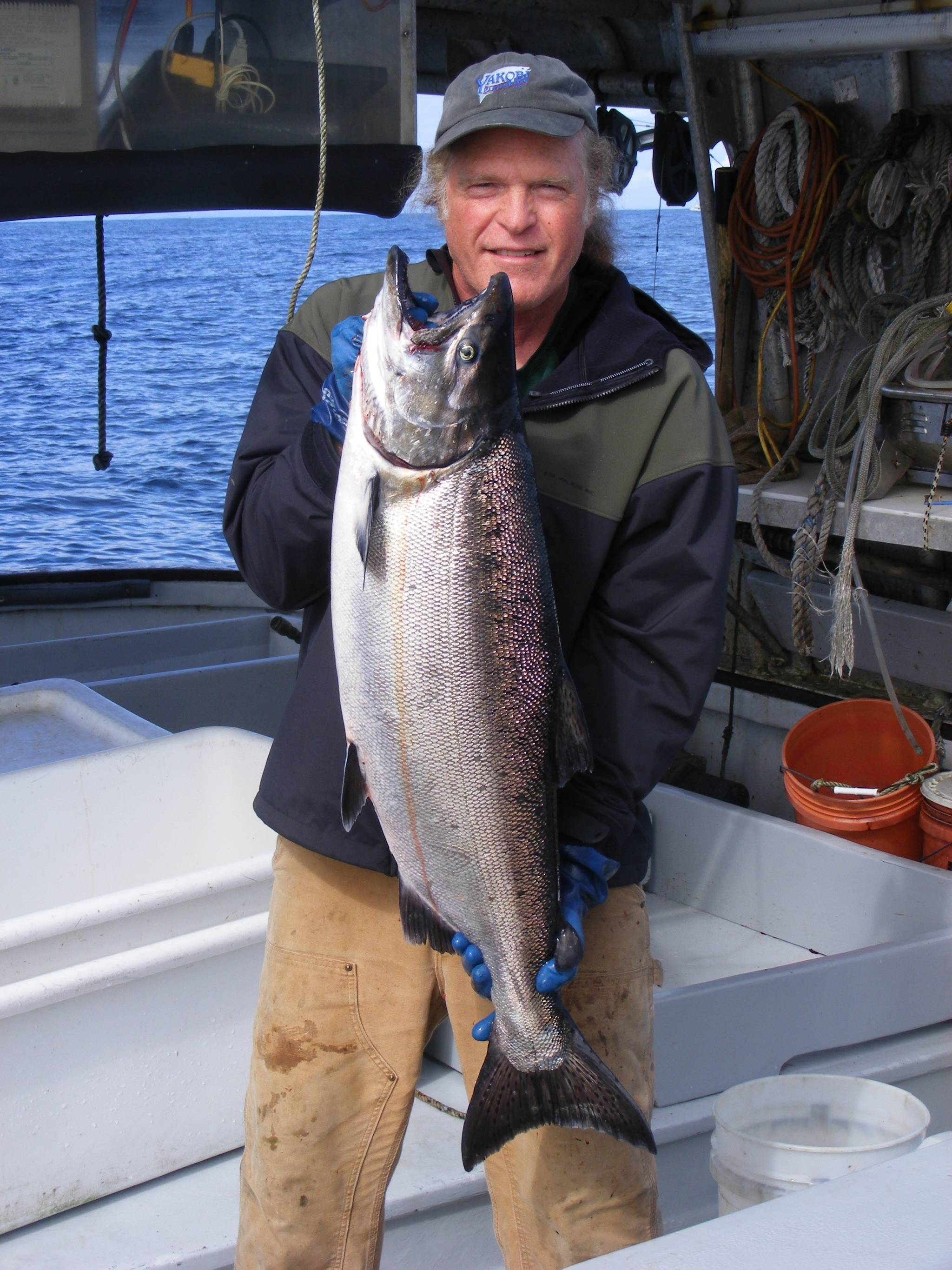 Joe Emerson, co-owner of Shoreline Wild Salmon, holds up a salmon. (Courtesy Photo | Joe Emerson)