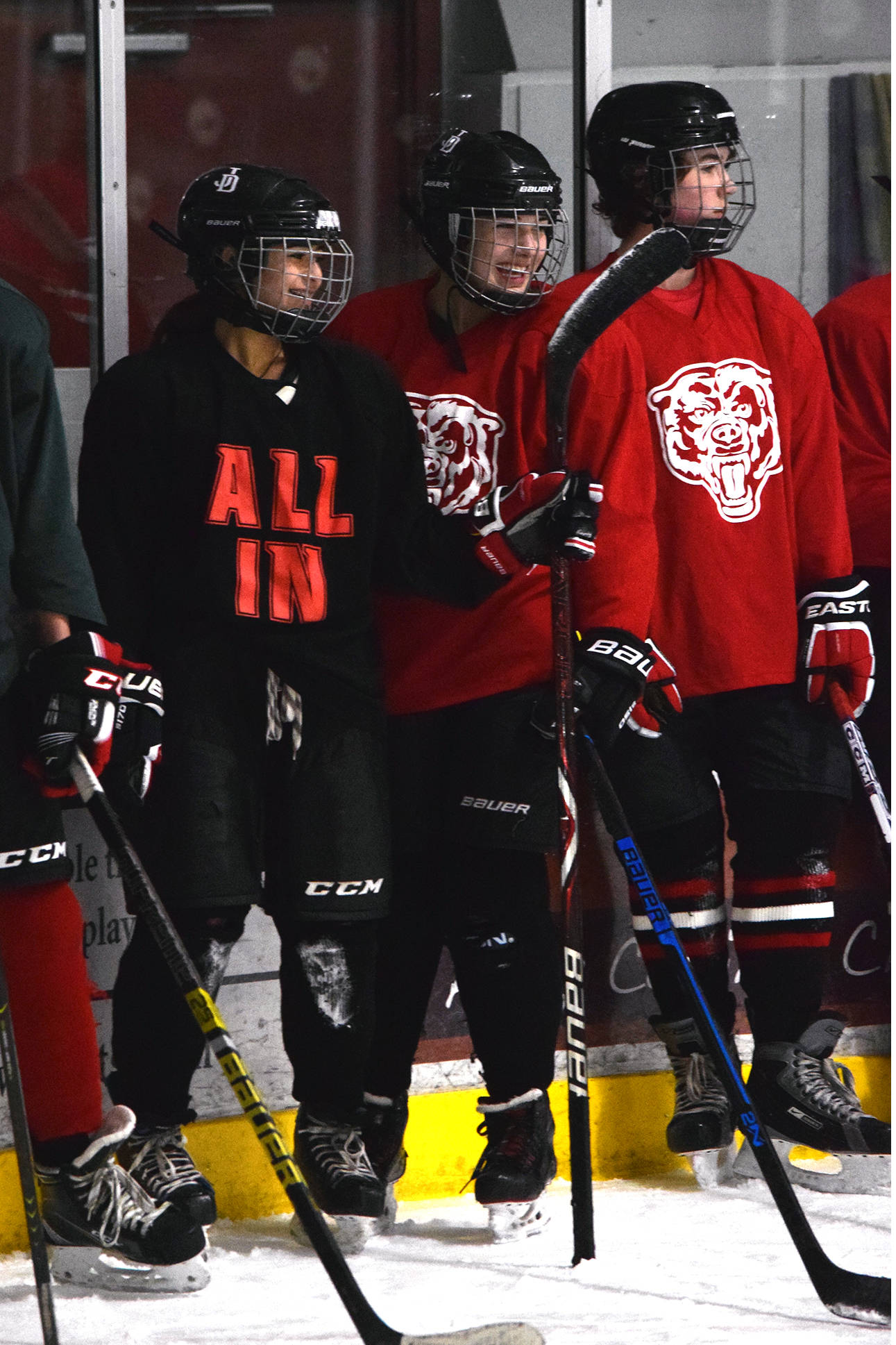 Juneau-Douglas: Yadaat.at Kale sophomores Nikki Lahnum, left, and Kyla Bentz share in a lighter moment during hockey practice at Treadwell Arena on Thursday, Oct. 31, 2019. (Nolin Ainsworth | Juneau Empire)