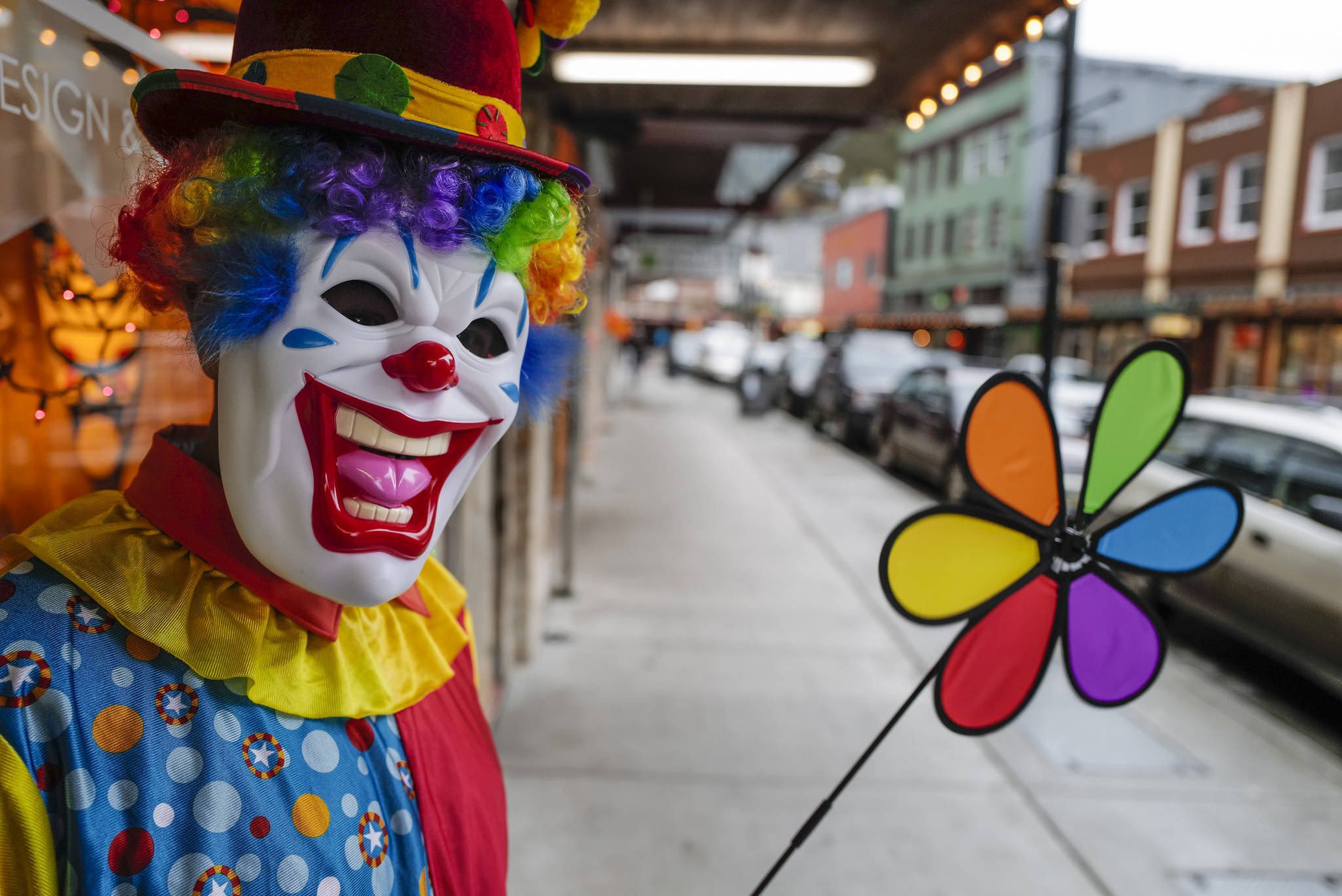Rico Worl, of The Trickster, waits to greet children during the Trick or Treat Downtown event on Thursday, Oct. 31, 2019. More than 70 business put out orange balloons to participate in the event aimed at young children. (Michael Penn | Juneau Empire)