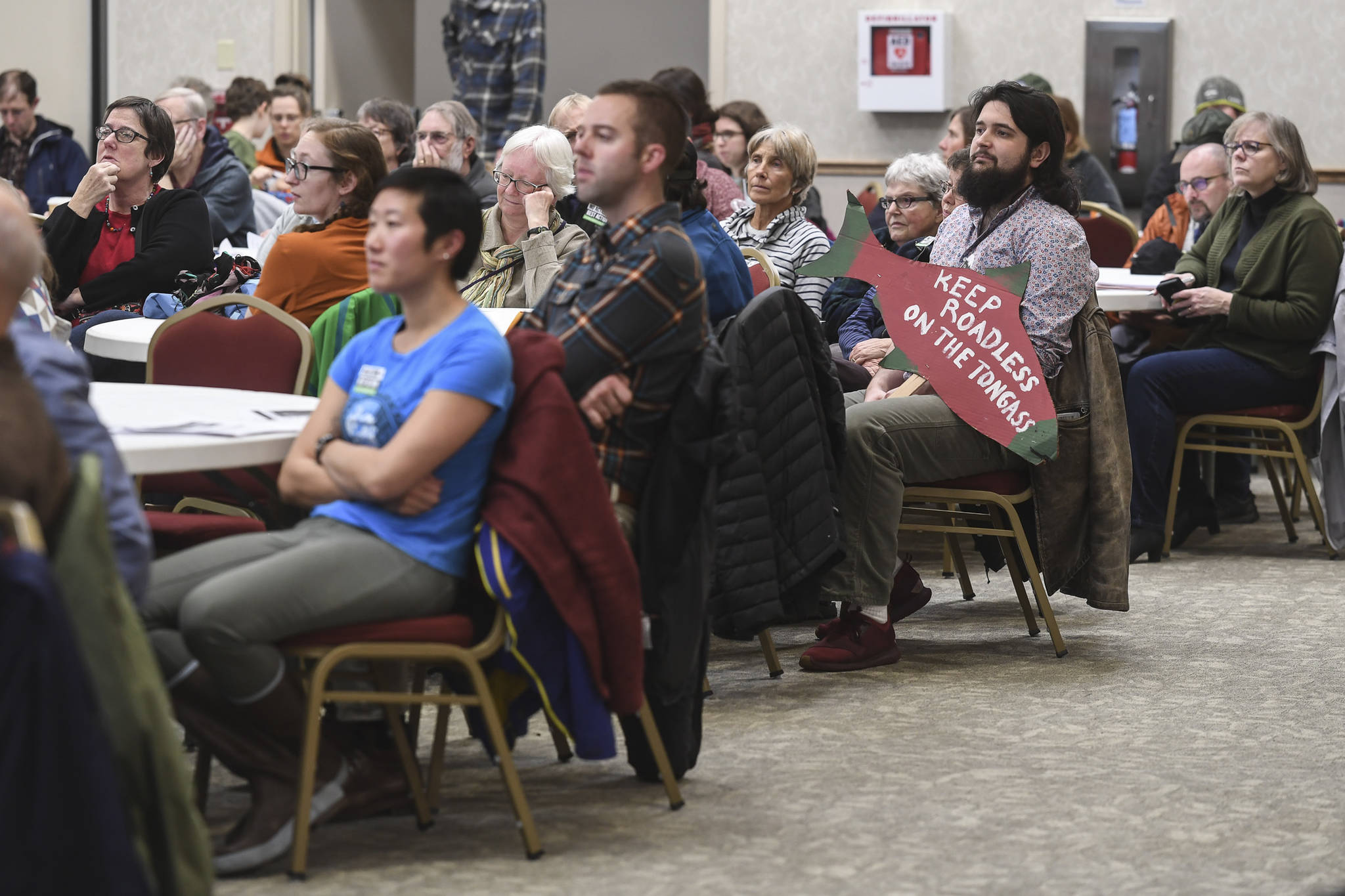 Juneau residents listen to a U.S. Department of Agriculture Forest Service meeting on the Rulemaking for Alaska Roadless Areas Draft Environmental Impact Statement at Elizabeth Peratrovich Hall on Monday, Nov. 4, 2019. (Michael Penn | Juneau Empire)
