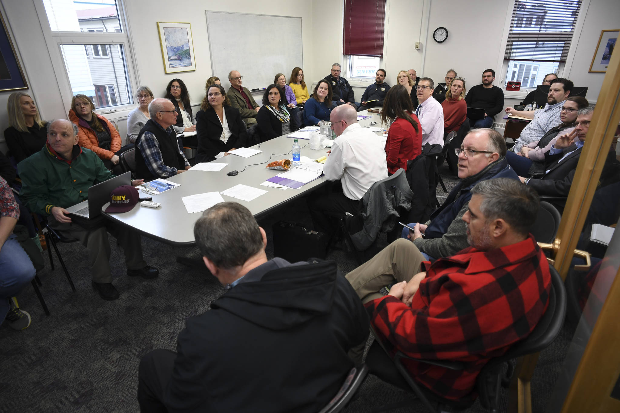 Members of the Visitor Industry Task Force, city employees and the public watch as City Manager Rorie Watt gives a presentation on the growth of the cruise ship industry in Juneau during a noon meeting at City Hall on Tuesday, Nov. 5, 2019. (Michael Penn | Juneau Empire)
