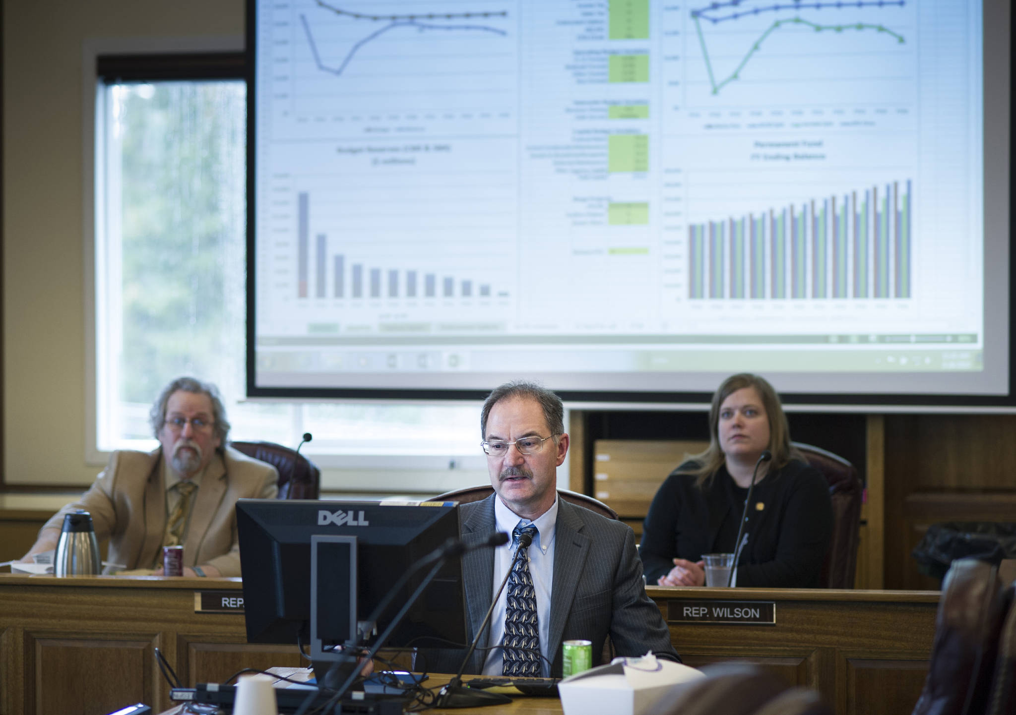 In this file photo, Legislative Finance Division Director David Teal gives legislators and their staffs a look at an interactive budget calculator during a lunchtime presentation in the House Finance Committee room at the Capitol. (Michael Penn | Juneau Empire File)