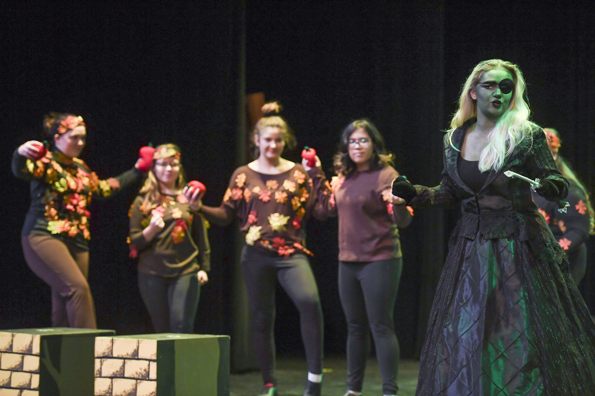 Mumbi the Wicked Witch, played by Olivia Bolin, has an encounter with the Enchanted Forest during rehearsal for the Thunder Mountain High School production of “Choose Your Own Oz” at TMHS on Friday, Nov. 8, 2019. (Michael Penn | Juneau Empire)